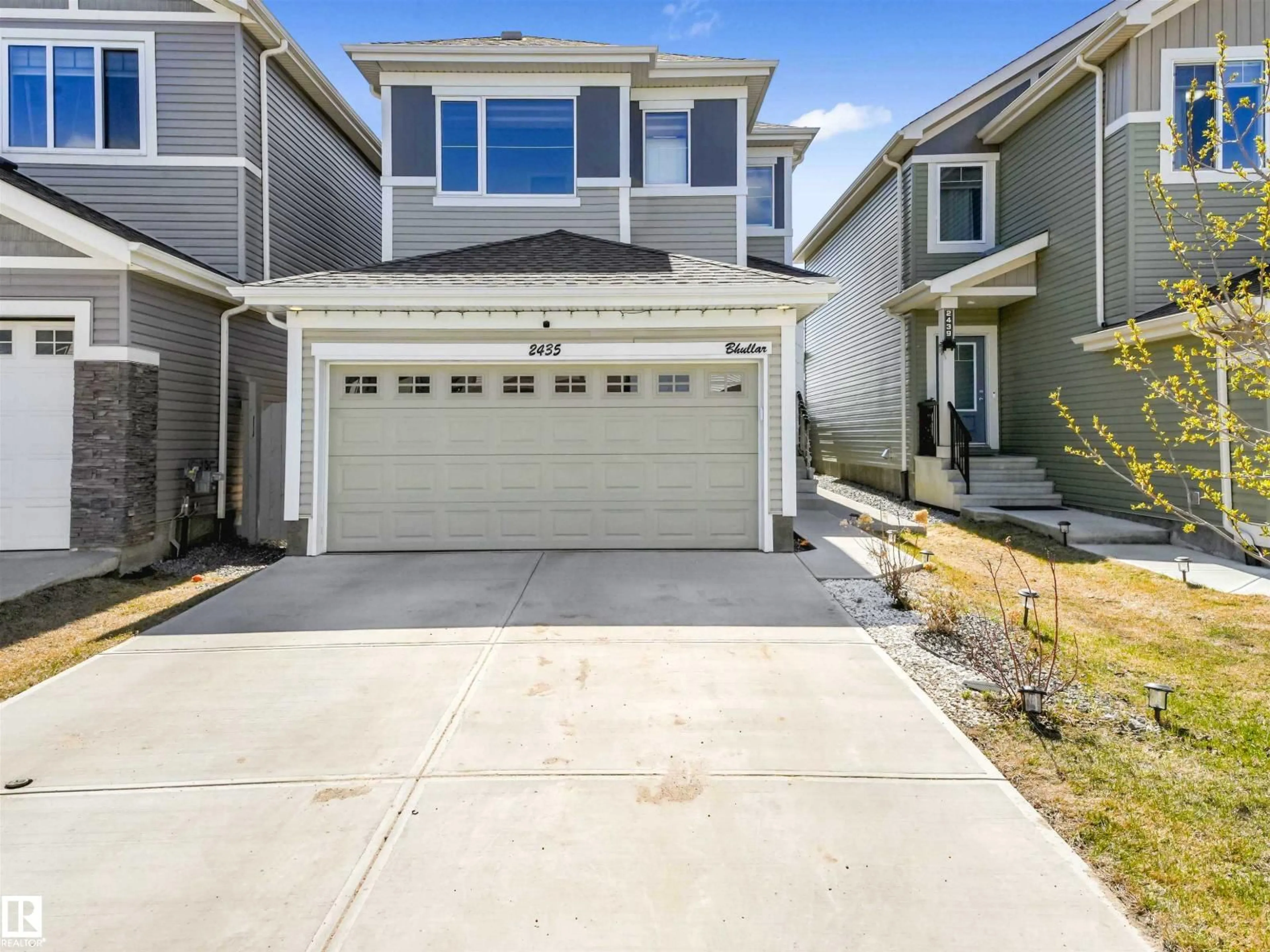 Home with vinyl exterior material, street for 2435 12 AV, Edmonton Alberta T6T2M6