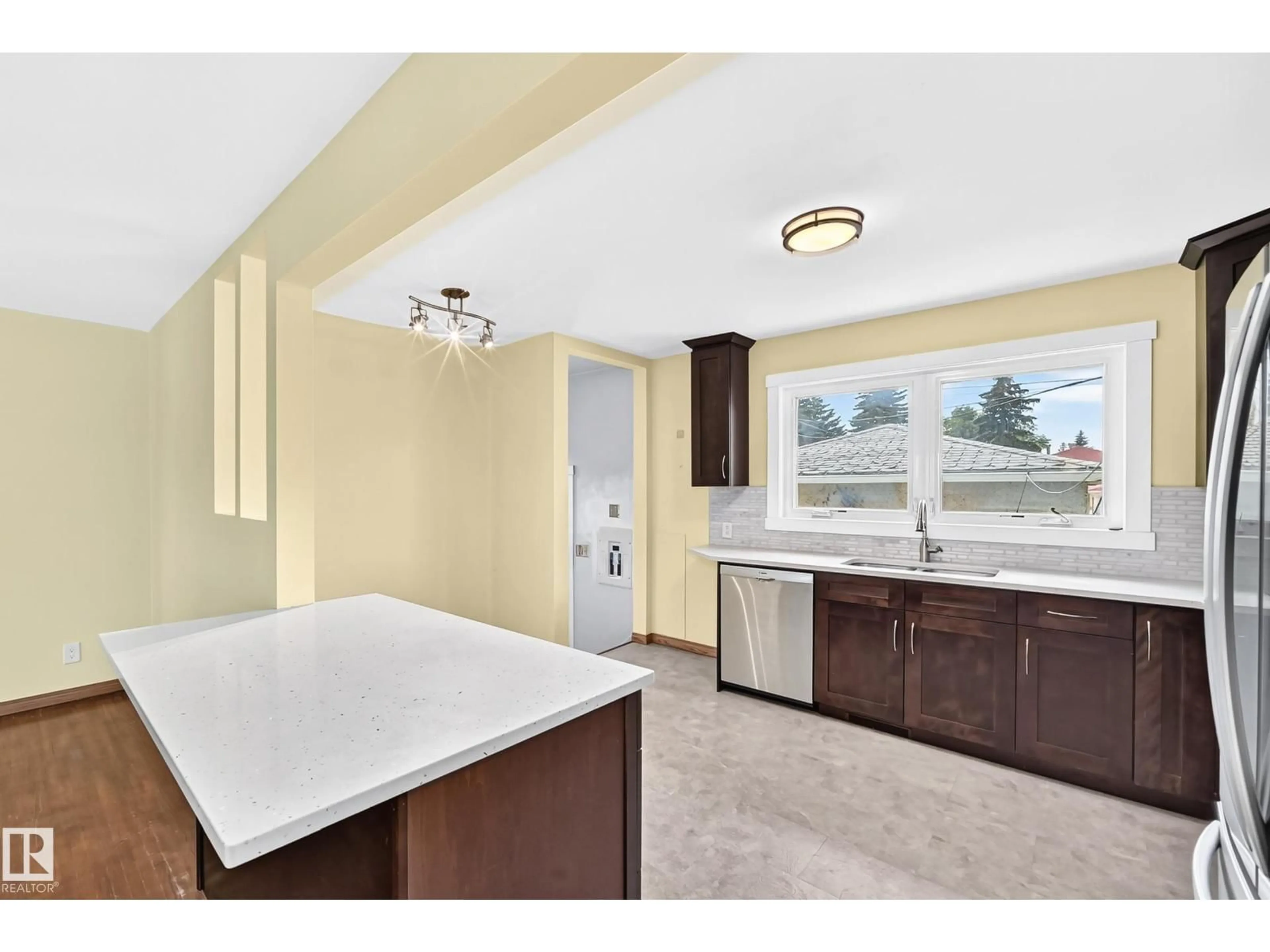 Open concept kitchen, ceramic/tile floor for 7032 81 ST, Edmonton Alberta T6C2T4