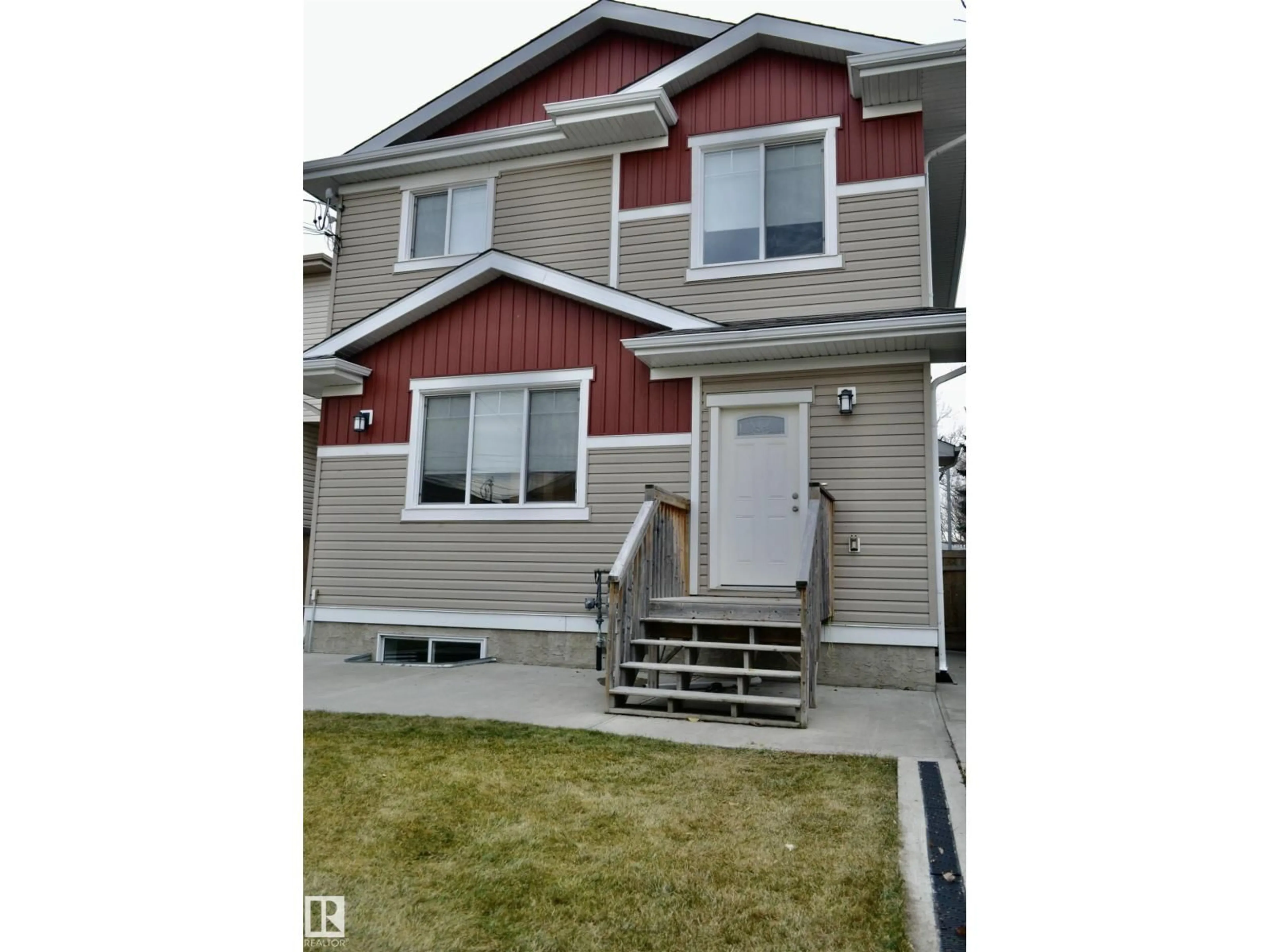Home with vinyl exterior material, street for 8952 81 AV, Edmonton Alberta T6C0W8