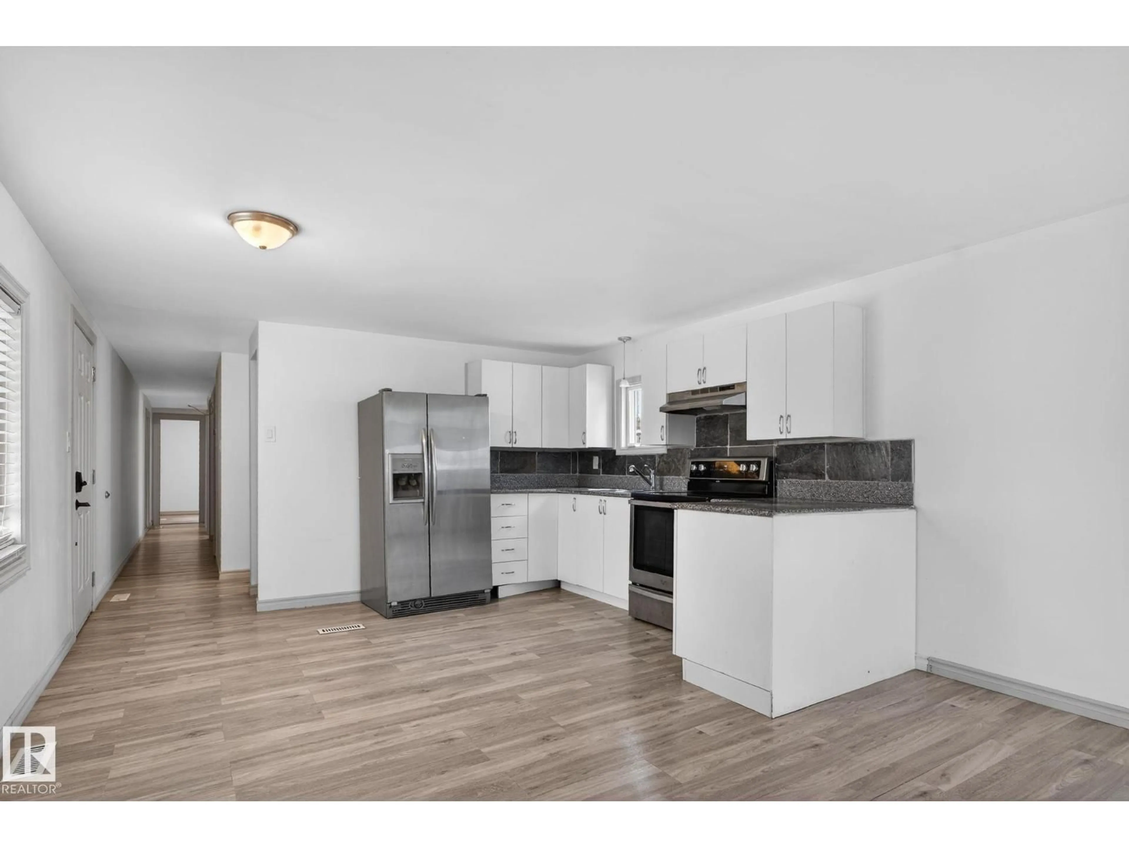 Open concept kitchen, wood/laminate floor for 543 EVERGREEN ST, Edmonton Alberta T5Y4M2