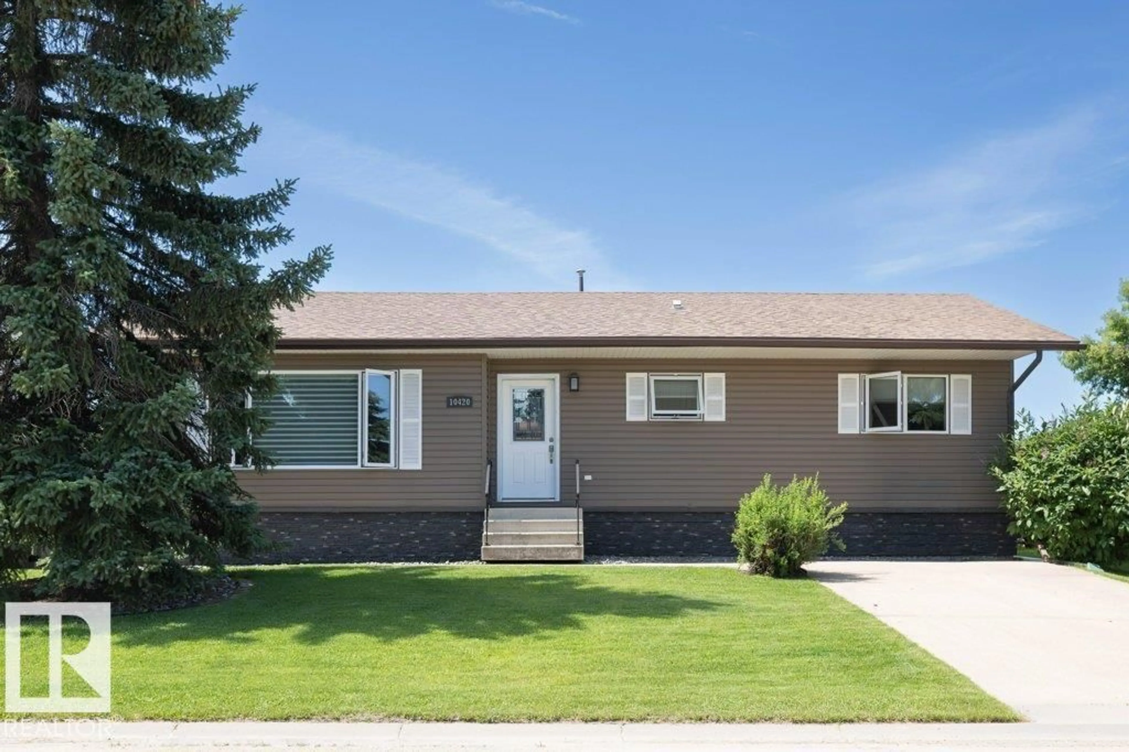 Home with vinyl exterior material, street for 10420 111 AV, Westlock Alberta T7P1E9