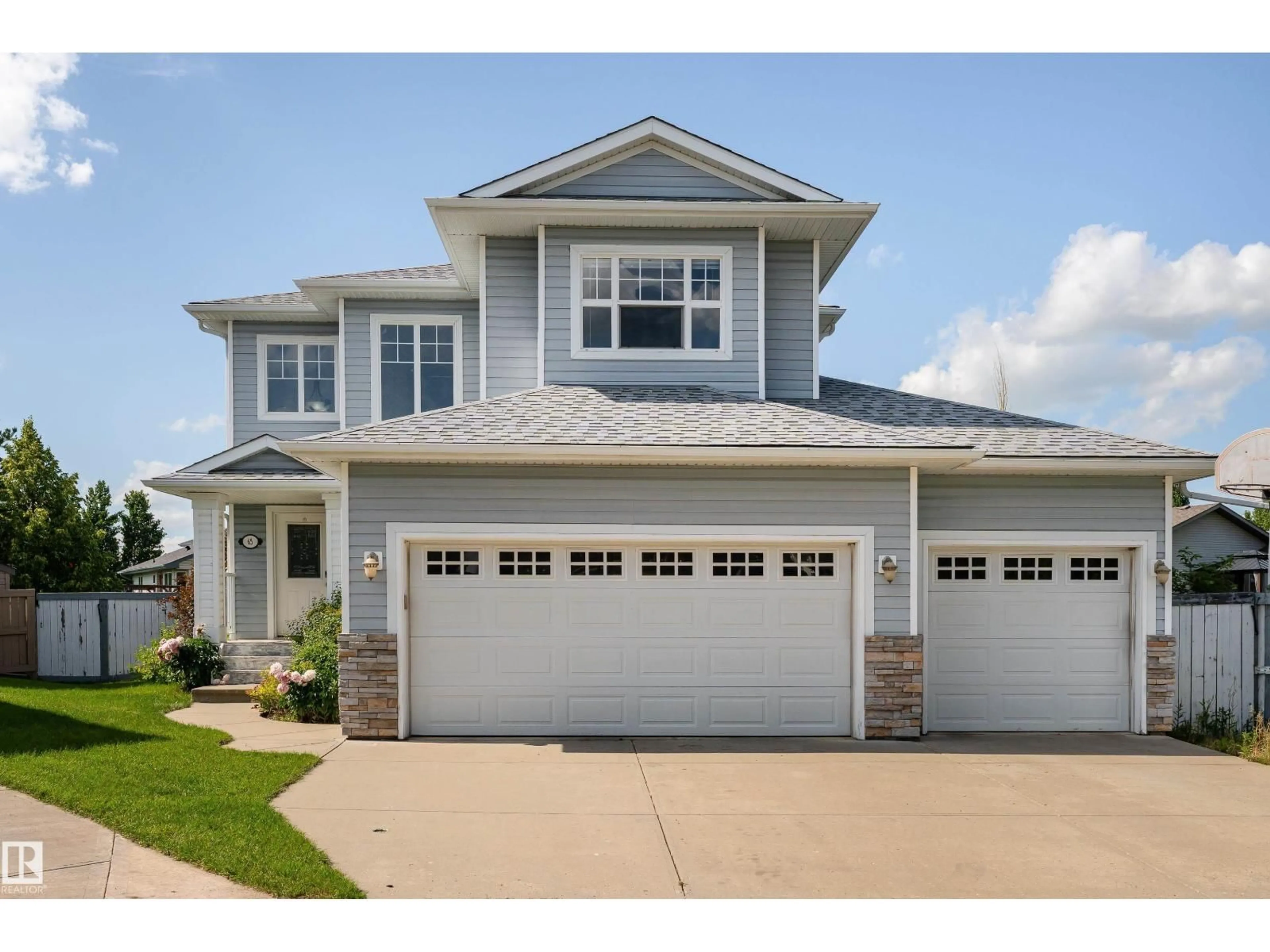 Home with vinyl exterior material, street for 65 WEDGEWOOD CR, Fort Saskatchewan Alberta T8L4S3