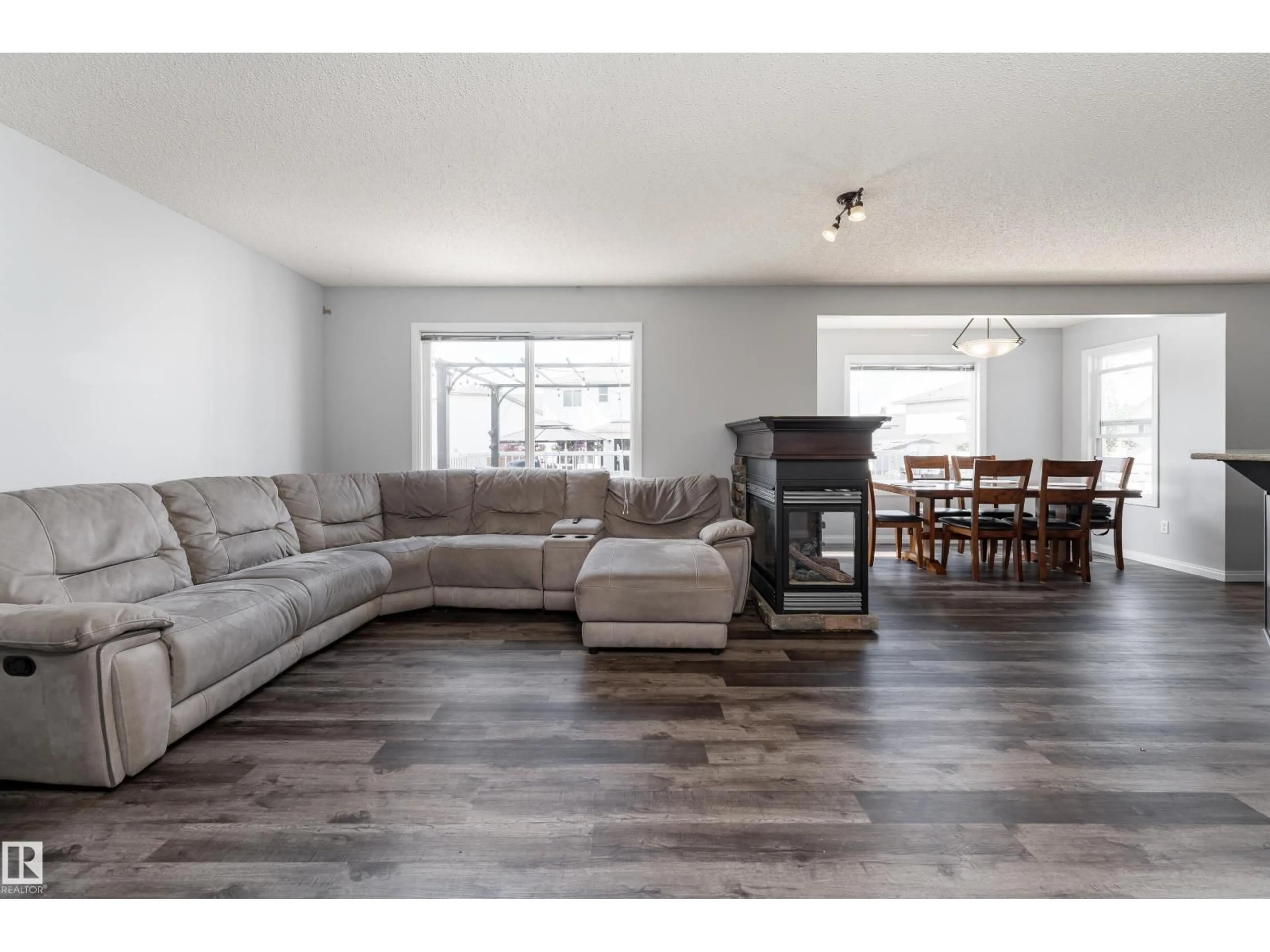 Living room with furniture, wood/laminate floor for 65 WEDGEWOOD CR, Fort Saskatchewan Alberta T8L4S3