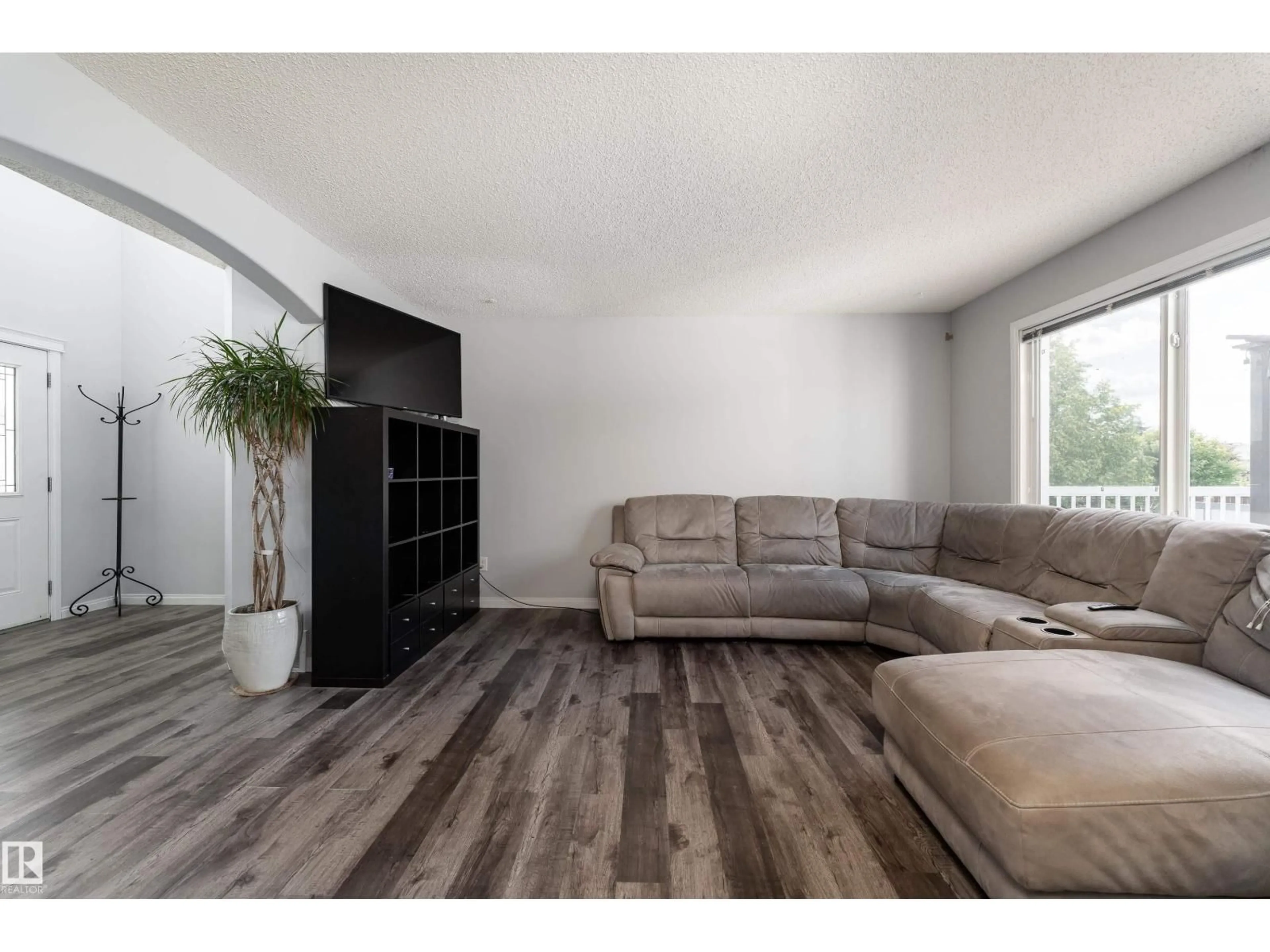 Living room with furniture, wood/laminate floor for 65 WEDGEWOOD CR, Fort Saskatchewan Alberta T8L4S3