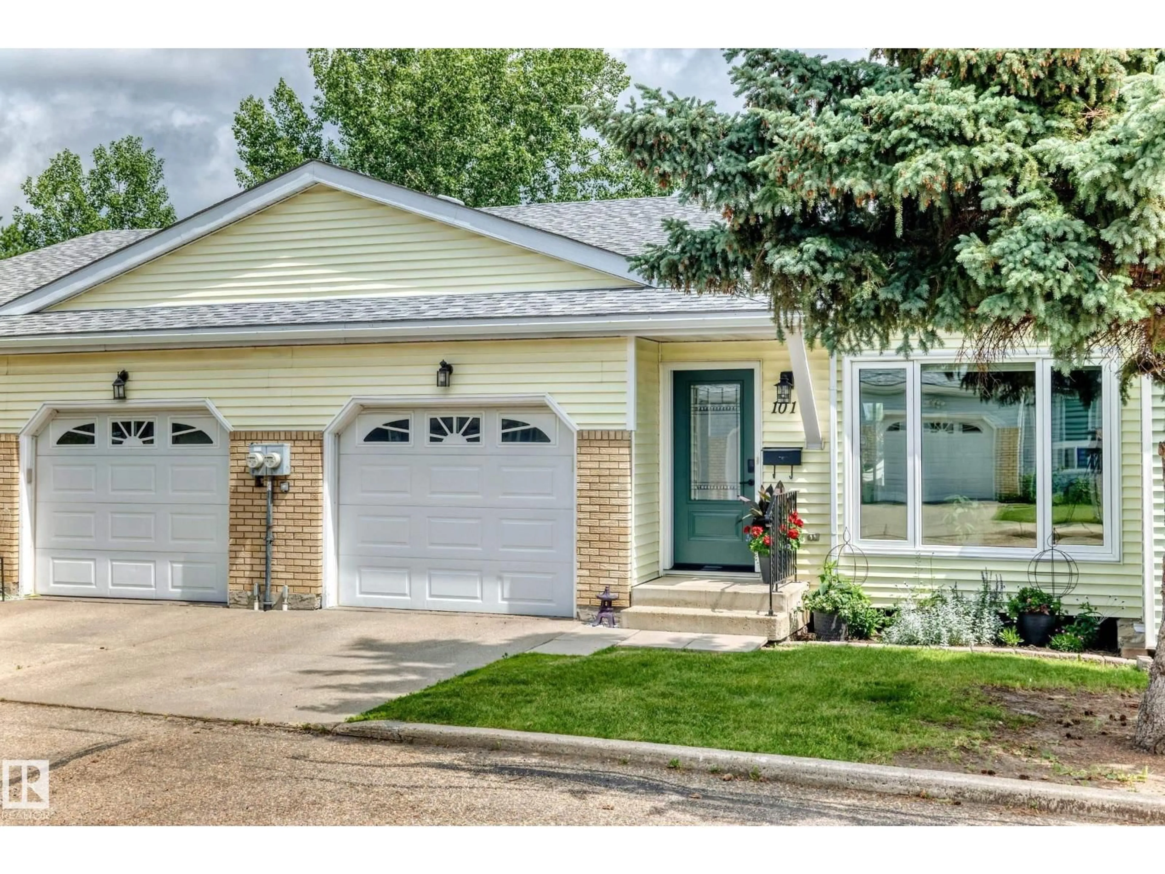 Home with vinyl exterior material, street for #101 - 17703 64 AV, Edmonton Alberta T5T5R8
