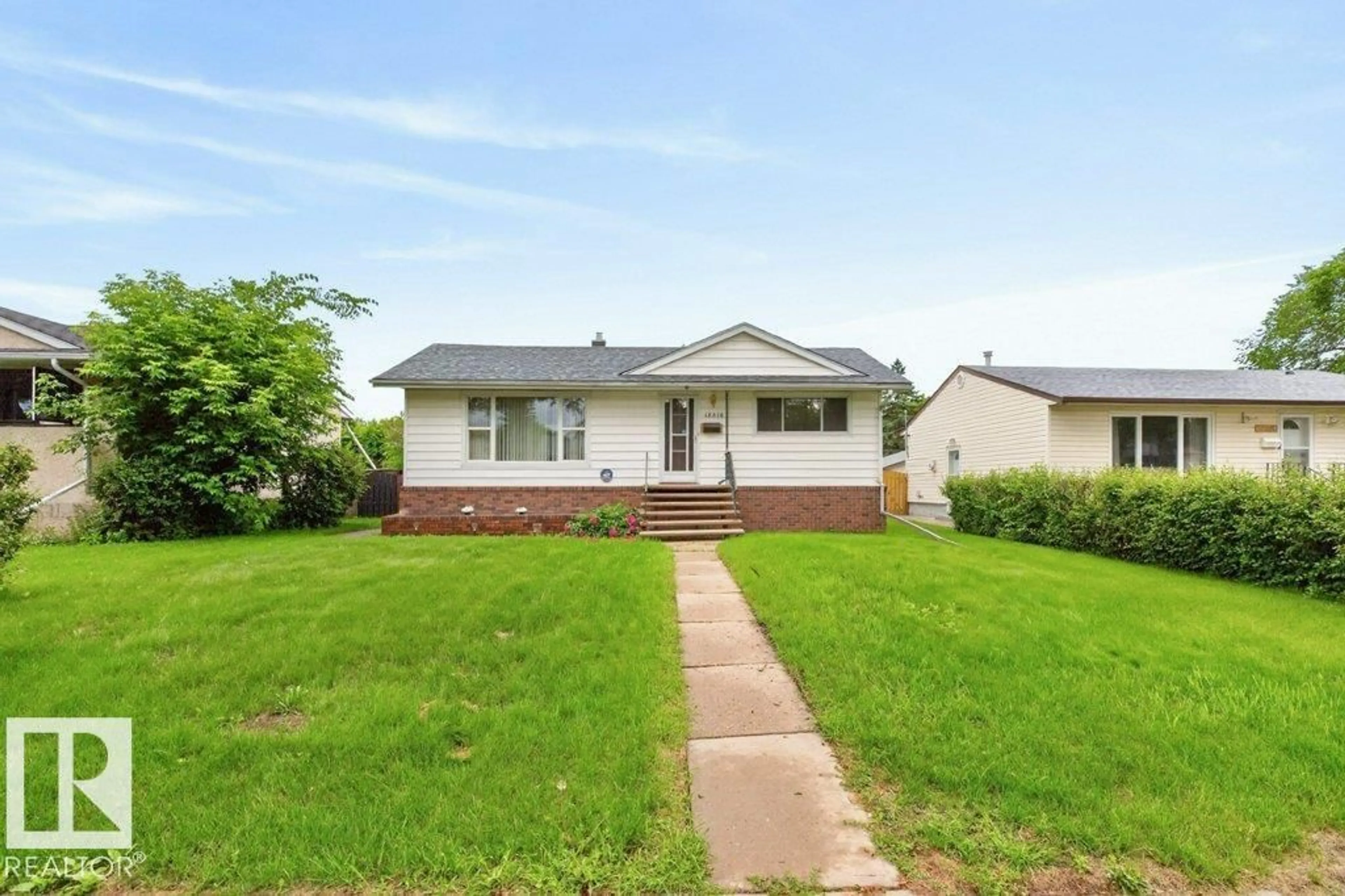 Home with vinyl exterior material, street for NW - 12316 129 ST, Edmonton Alberta T5L1H4