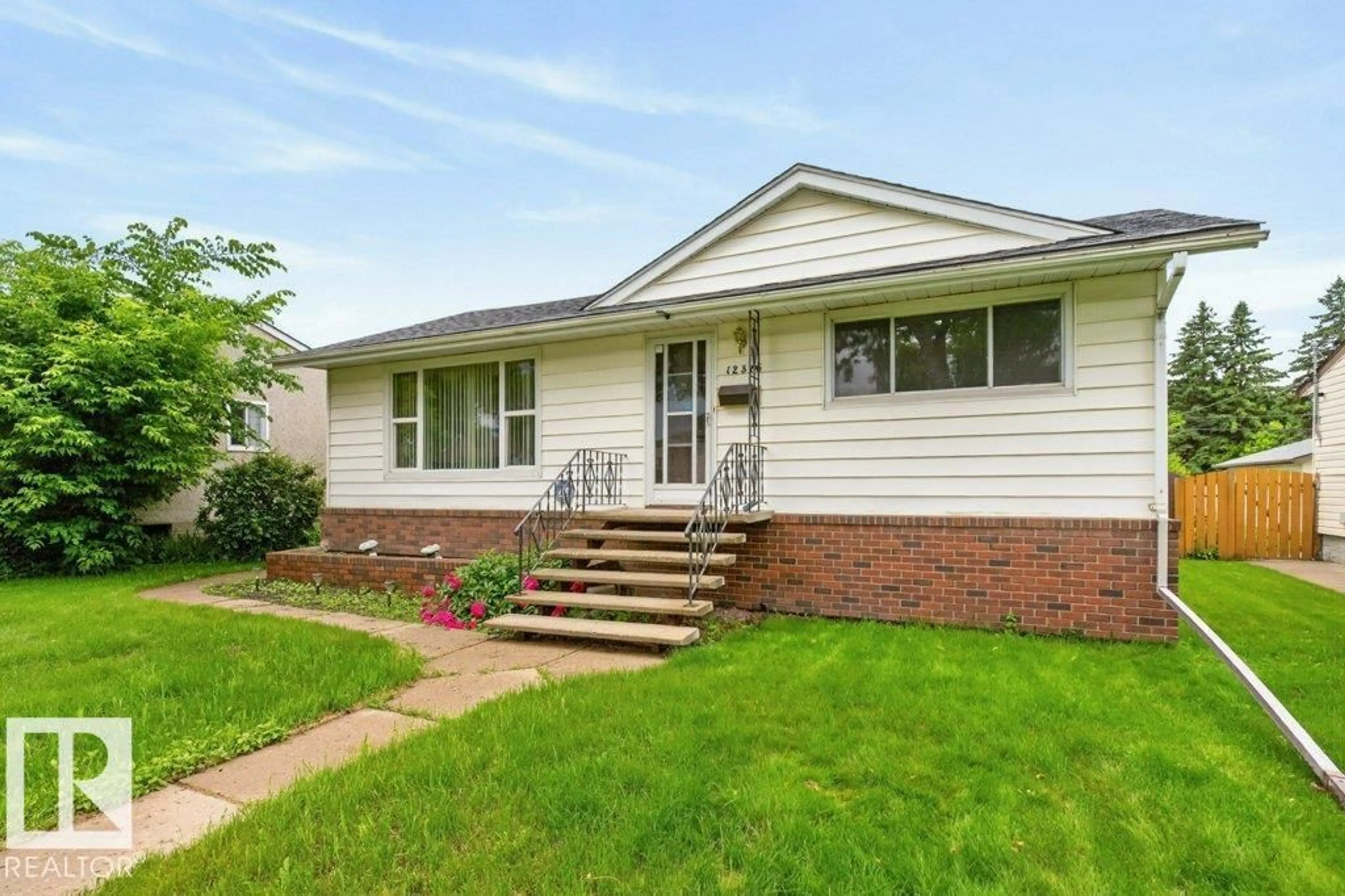 Home with vinyl exterior material, street for NW - 12316 129 ST, Edmonton Alberta T5L1H4