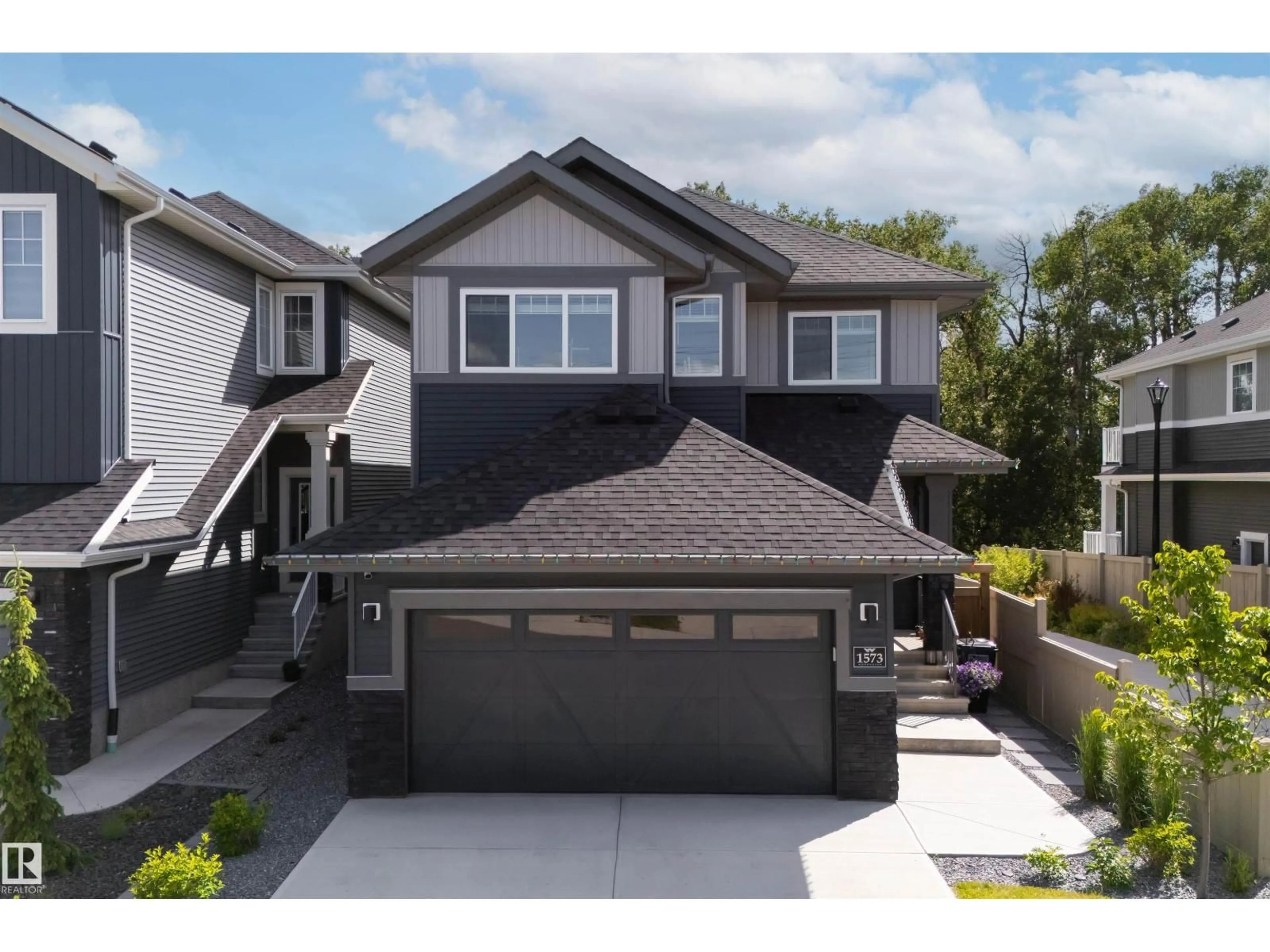 Home with vinyl exterior material, street for 1573 ESAIW PL, Edmonton Alberta T6M0E5