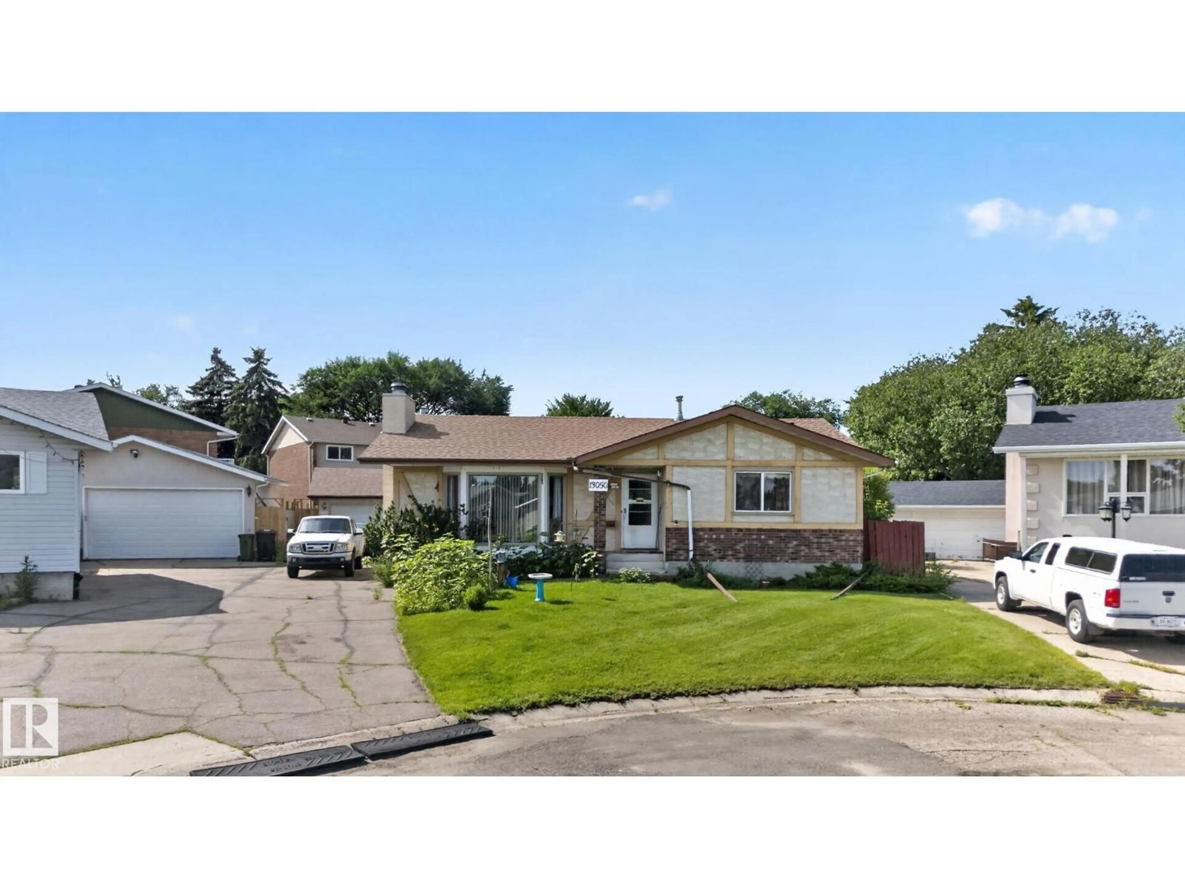 Home with vinyl exterior material, street for NW - 13050 32A ST, Edmonton Alberta T5A3E5
