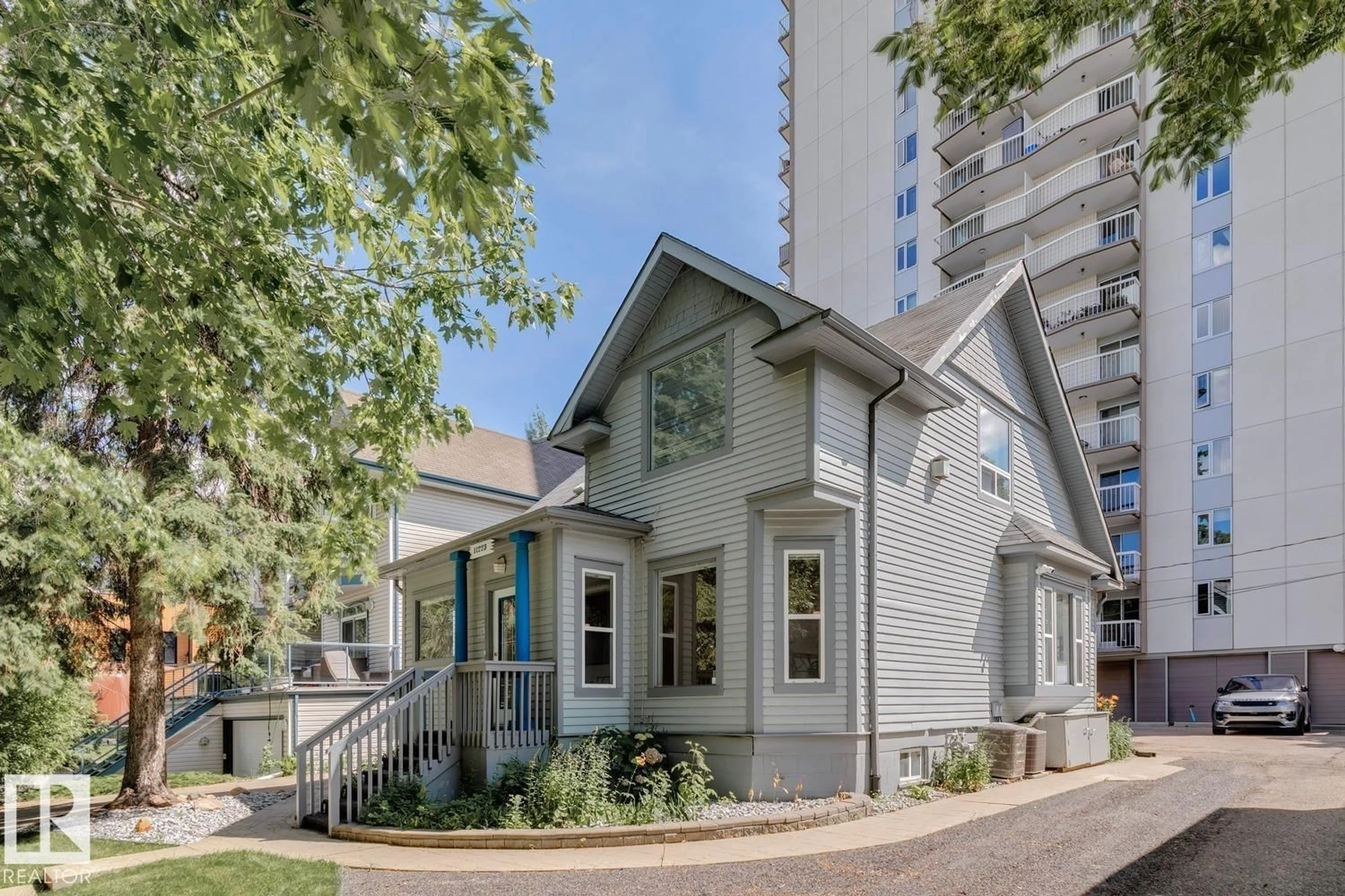 Home with vinyl exterior material, street for NW - 11223 99 AV, Edmonton Alberta T5K0G9