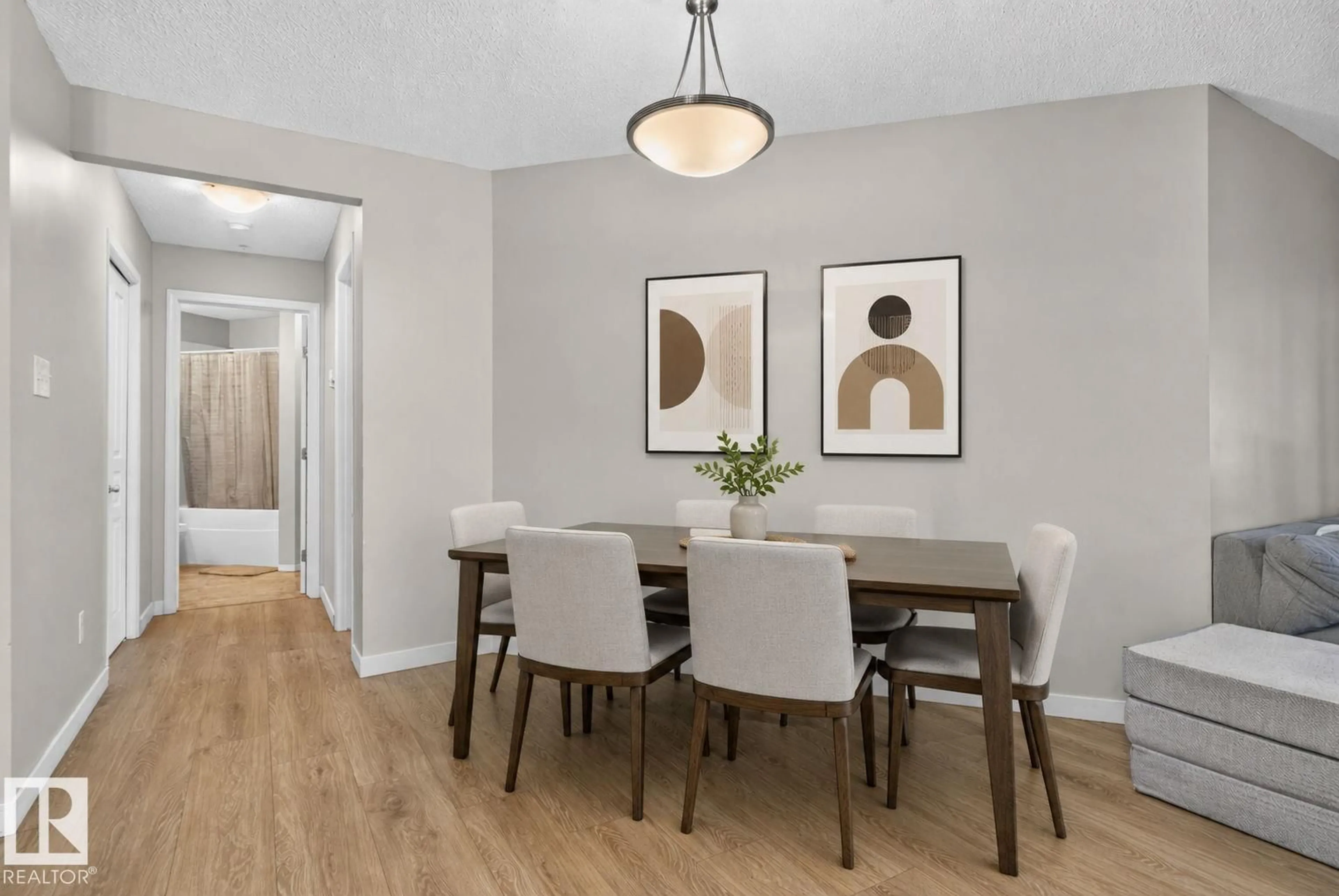 Dining room, wood/laminate floor for #140 - 301 CLAREVIEW STATION DR, Edmonton Alberta T5Y0J4