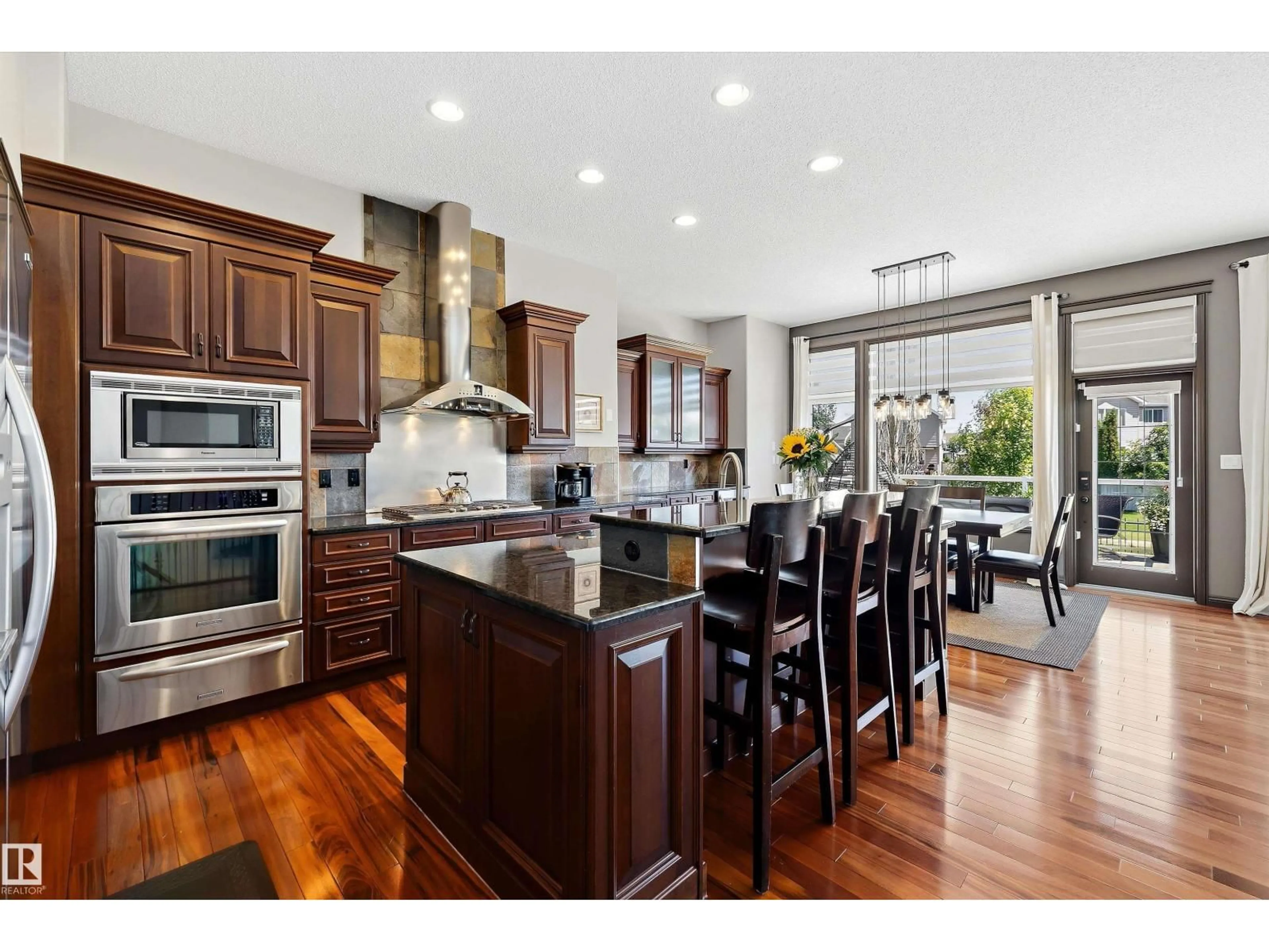Open concept kitchen, wood/laminate floor for 533 STEWART CR, Edmonton Alberta T6X0A8