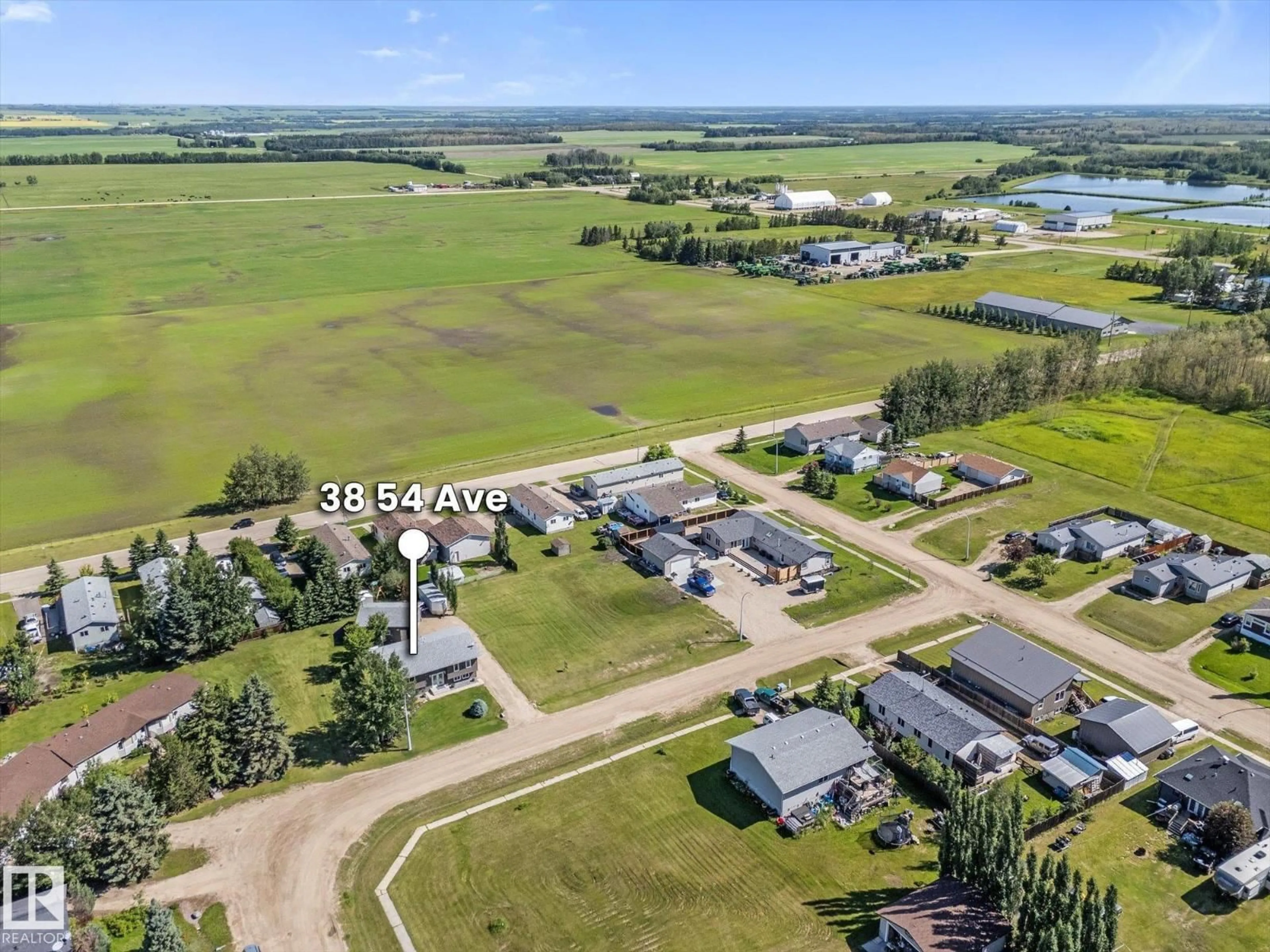 A pic from outside/outdoor area/front of a property/back of a property/a pic from drone, water/lake/river/ocean view for 38 WOODBEND CR, Warburg Alberta T0C2T0