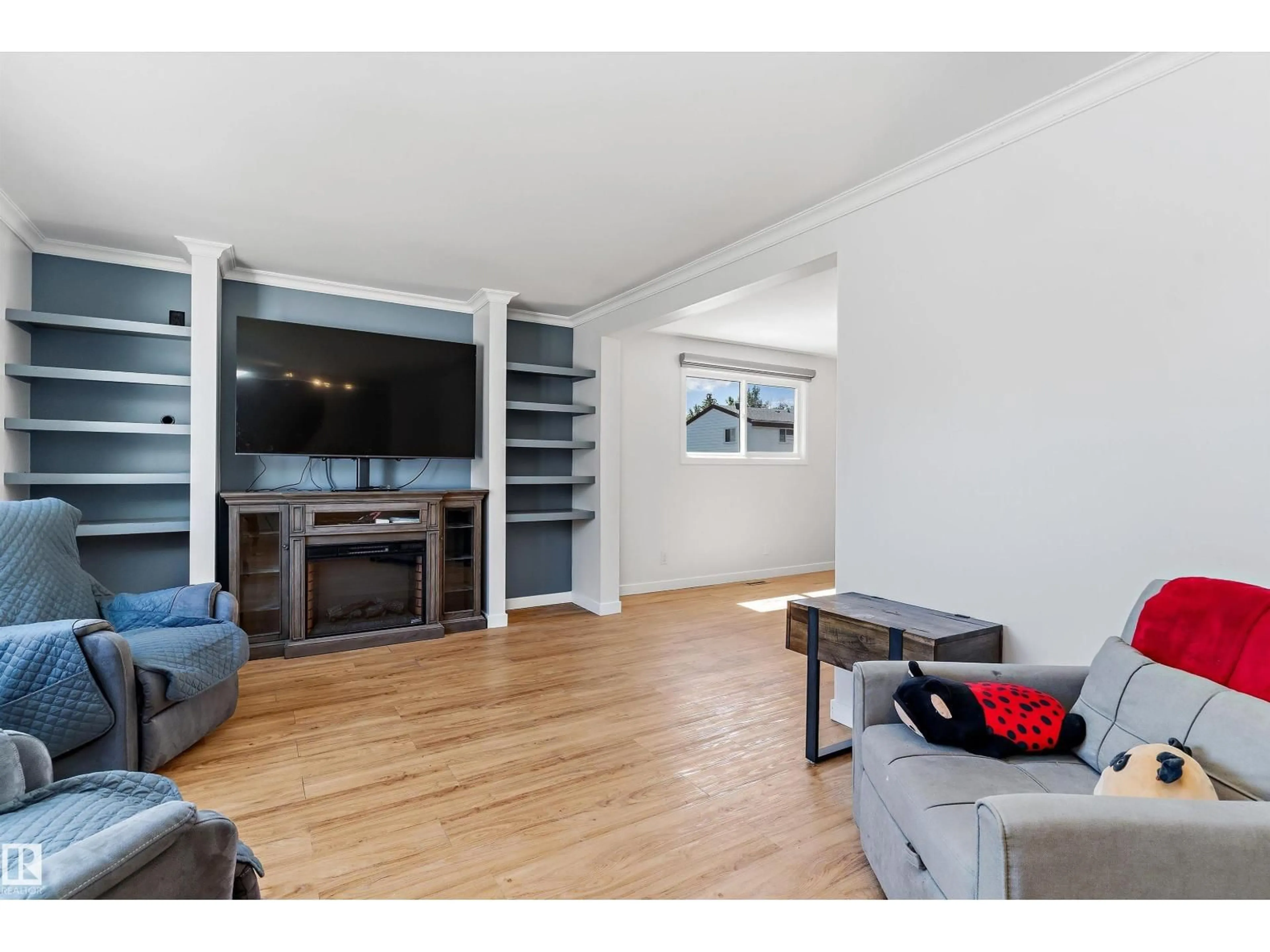 Living room with furniture, wood/laminate floor for 14F TWIN TC NW, Edmonton Alberta T6K1V4