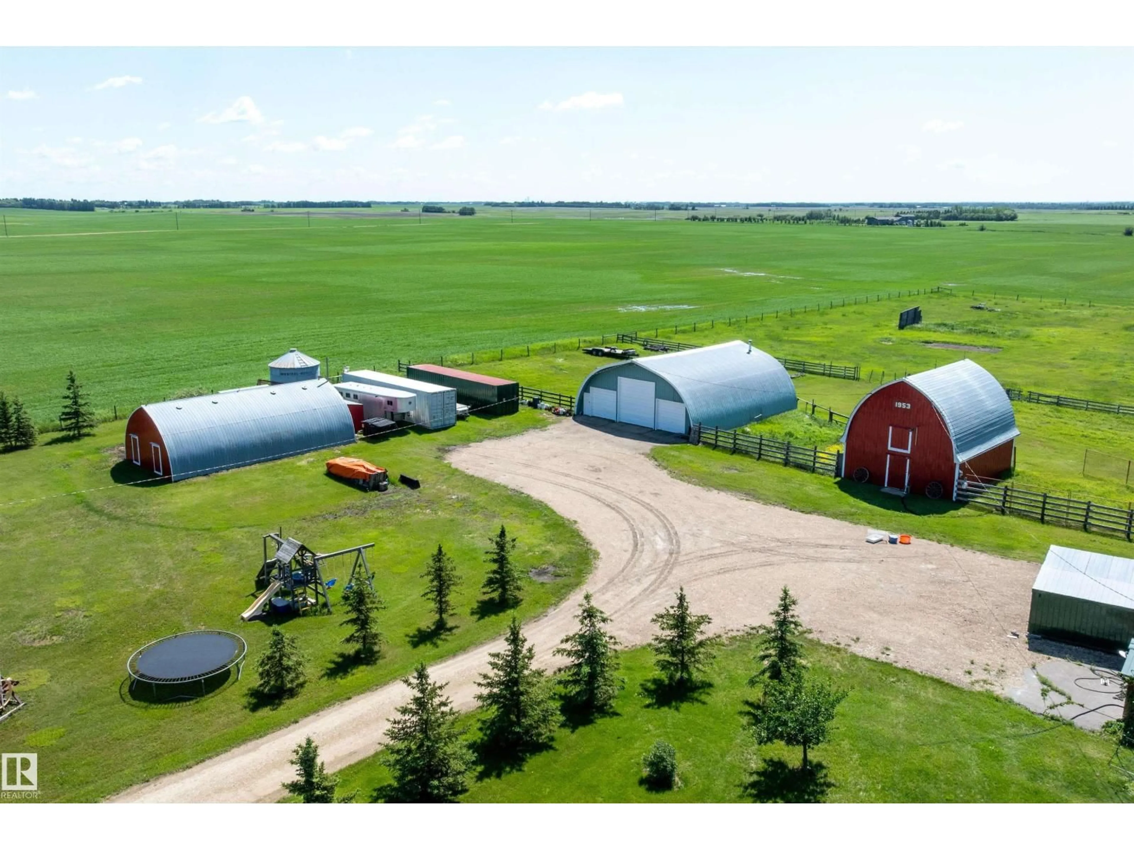 A pic from outside/outdoor area/front of a property/back of a property/a pic from drone, building for 26409 HWY 37, Rural Sturgeon County Alberta T8T0H6