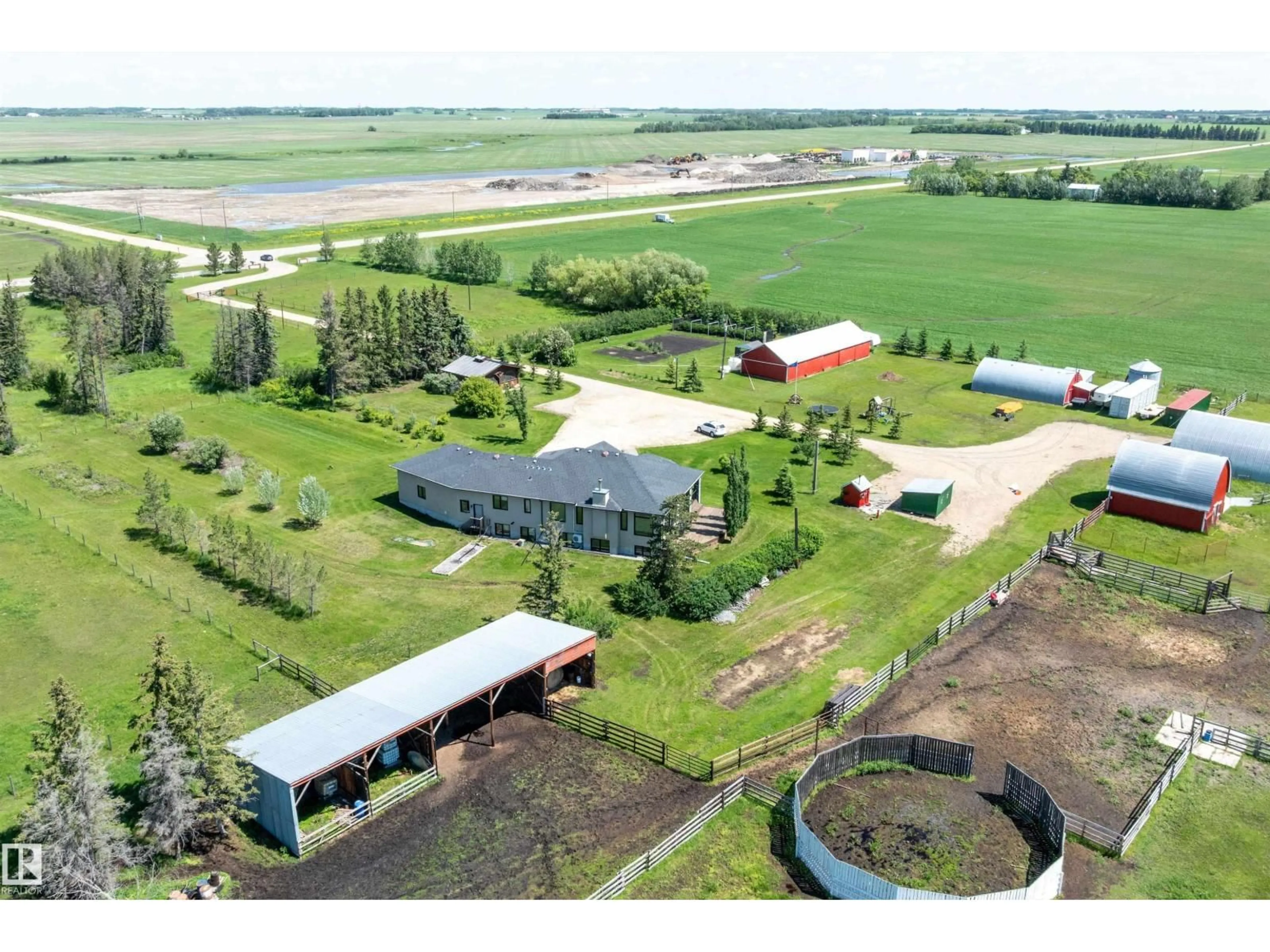 A pic from outside/outdoor area/front of a property/back of a property/a pic from drone, building for 26409 HWY 37, Rural Sturgeon County Alberta T8T0H6