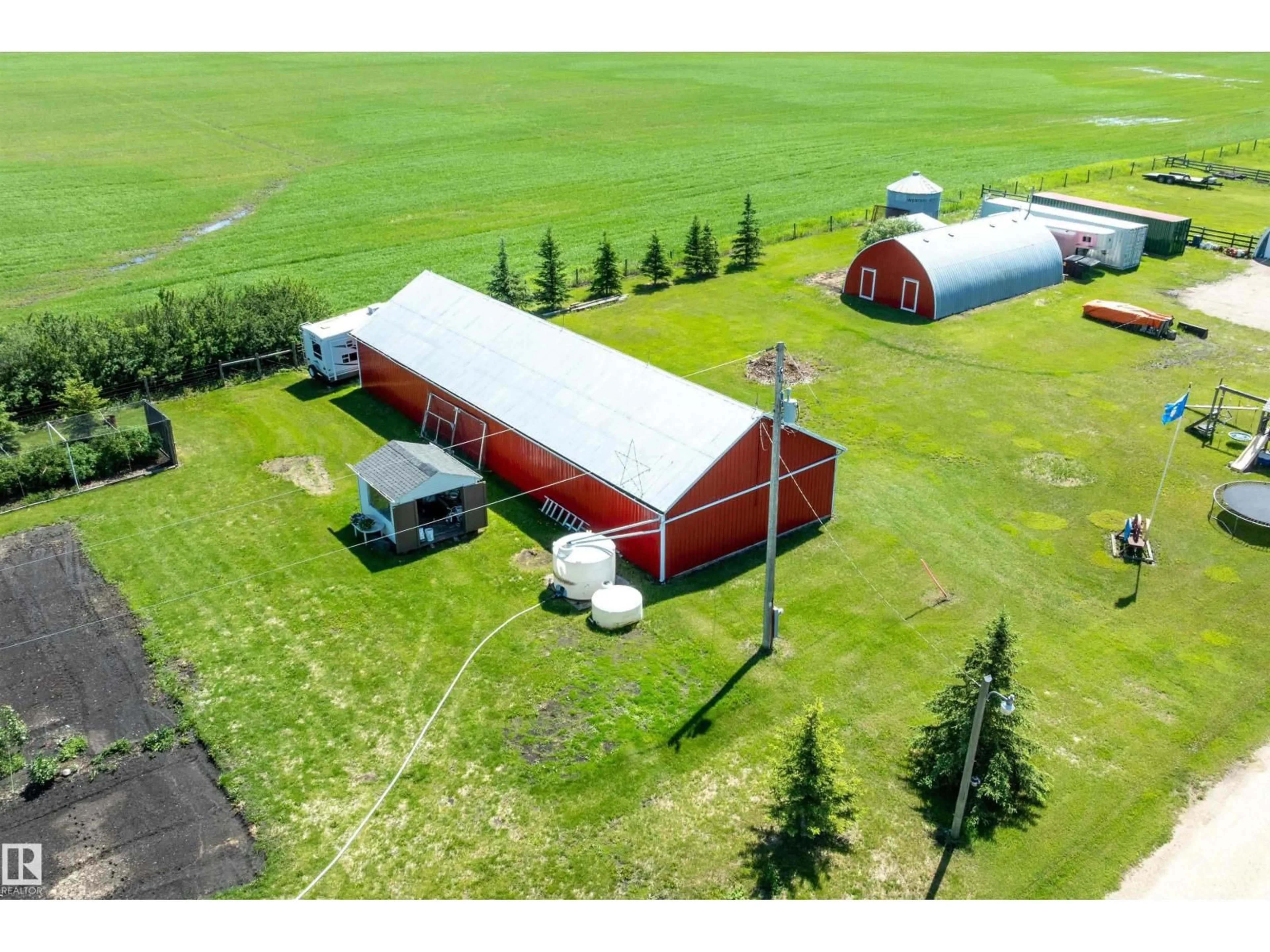A pic from outside/outdoor area/front of a property/back of a property/a pic from drone, building for 26409 HWY 37, Rural Sturgeon County Alberta T8T0H6