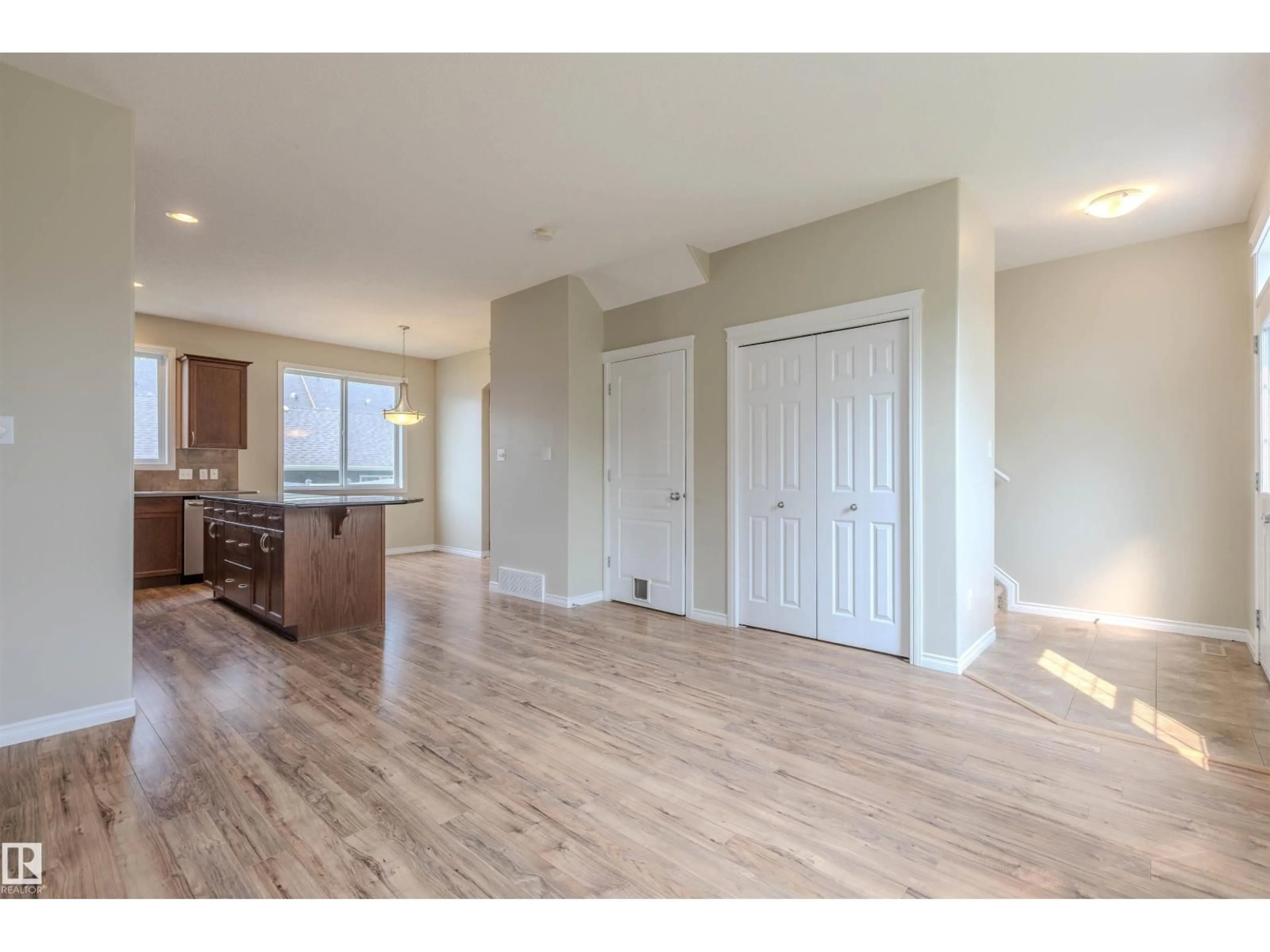 Open concept kitchen, wood/laminate floor for 9812 104 AV, Morinville Alberta T8R0C2