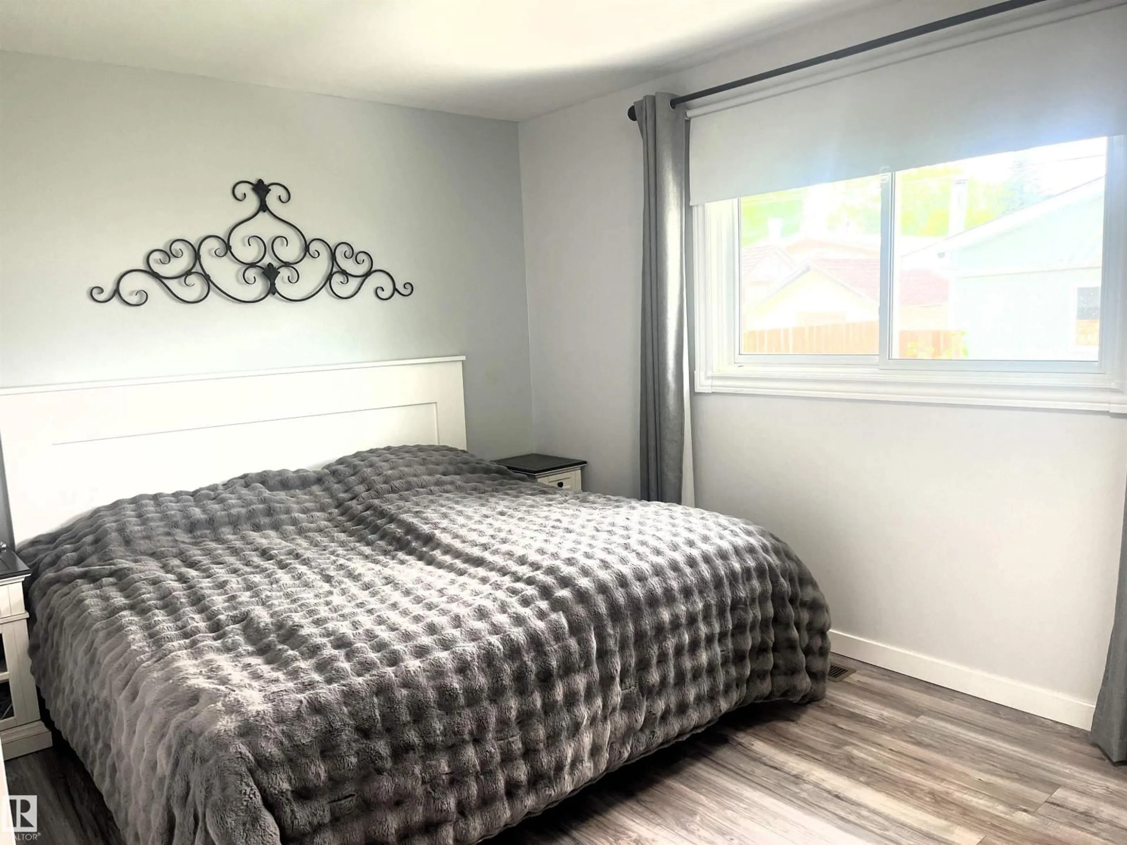 Bedroom with bed, wood/laminate floor for 4812 47 ST, Drayton Valley Alberta T7A1H8