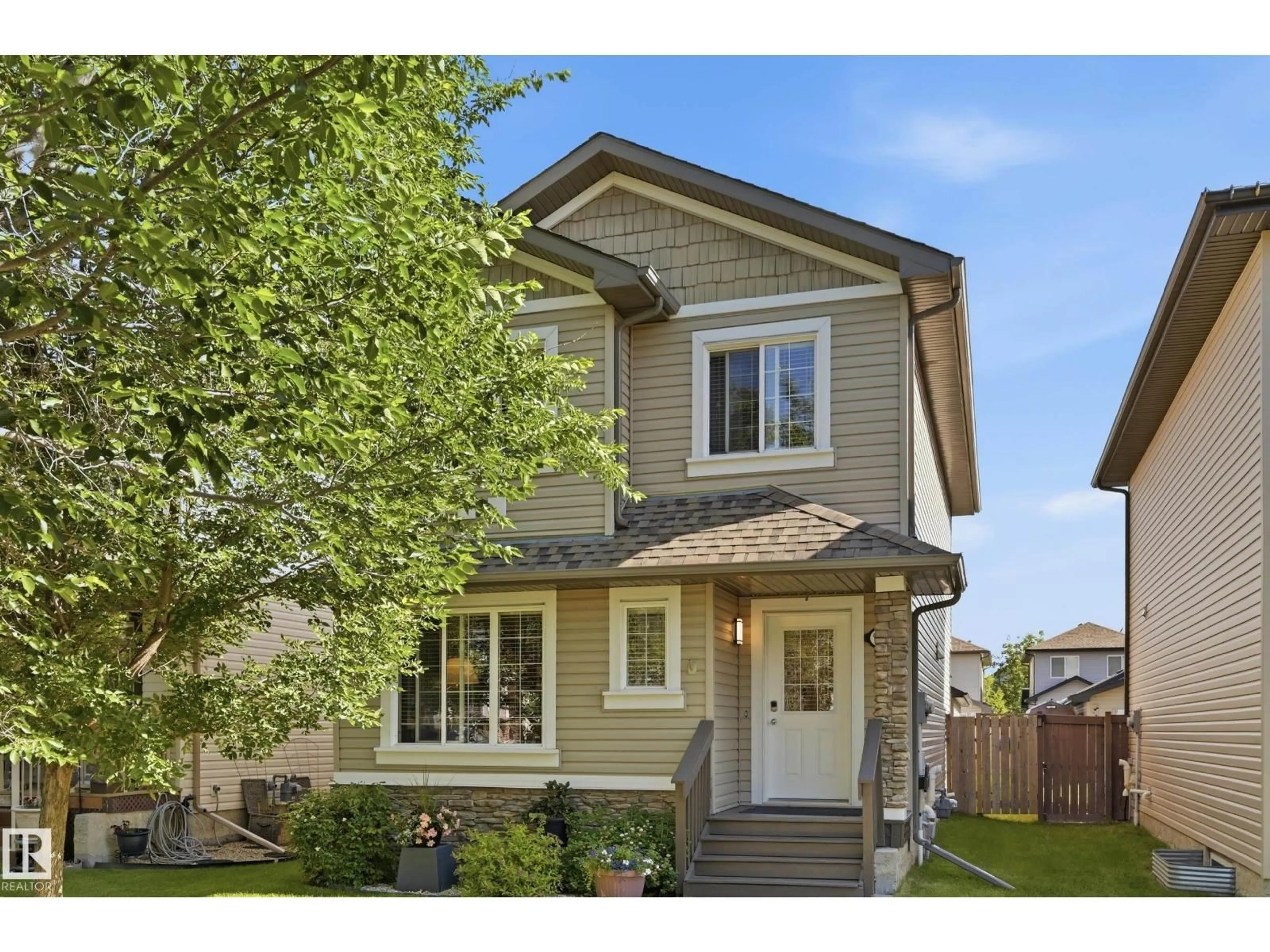 Home with vinyl exterior material, street for 9817 104, Morinville Alberta T8R0C2