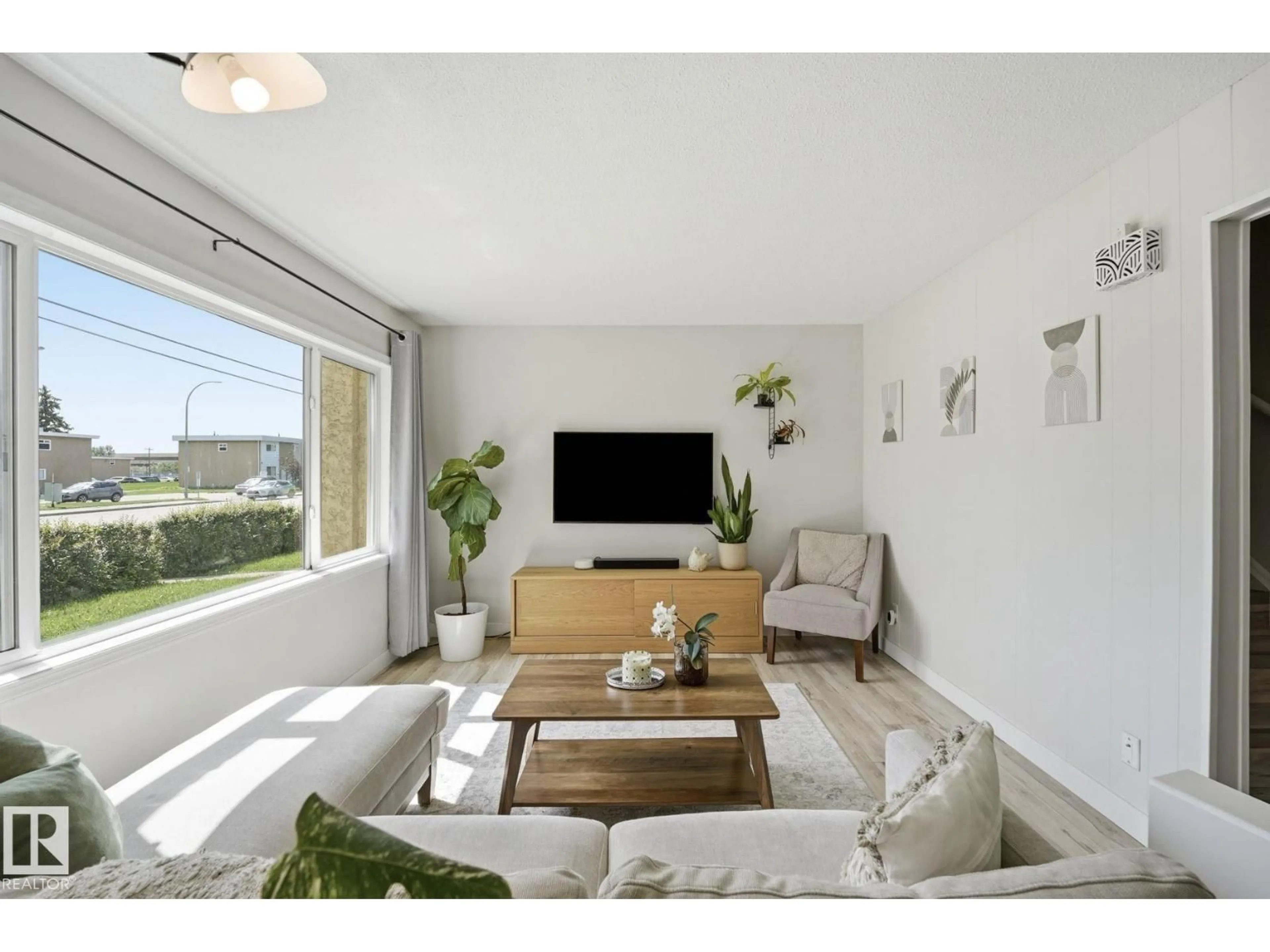 Living room with furniture, unknown for 10622 51 AV, Edmonton Alberta T6H0K9