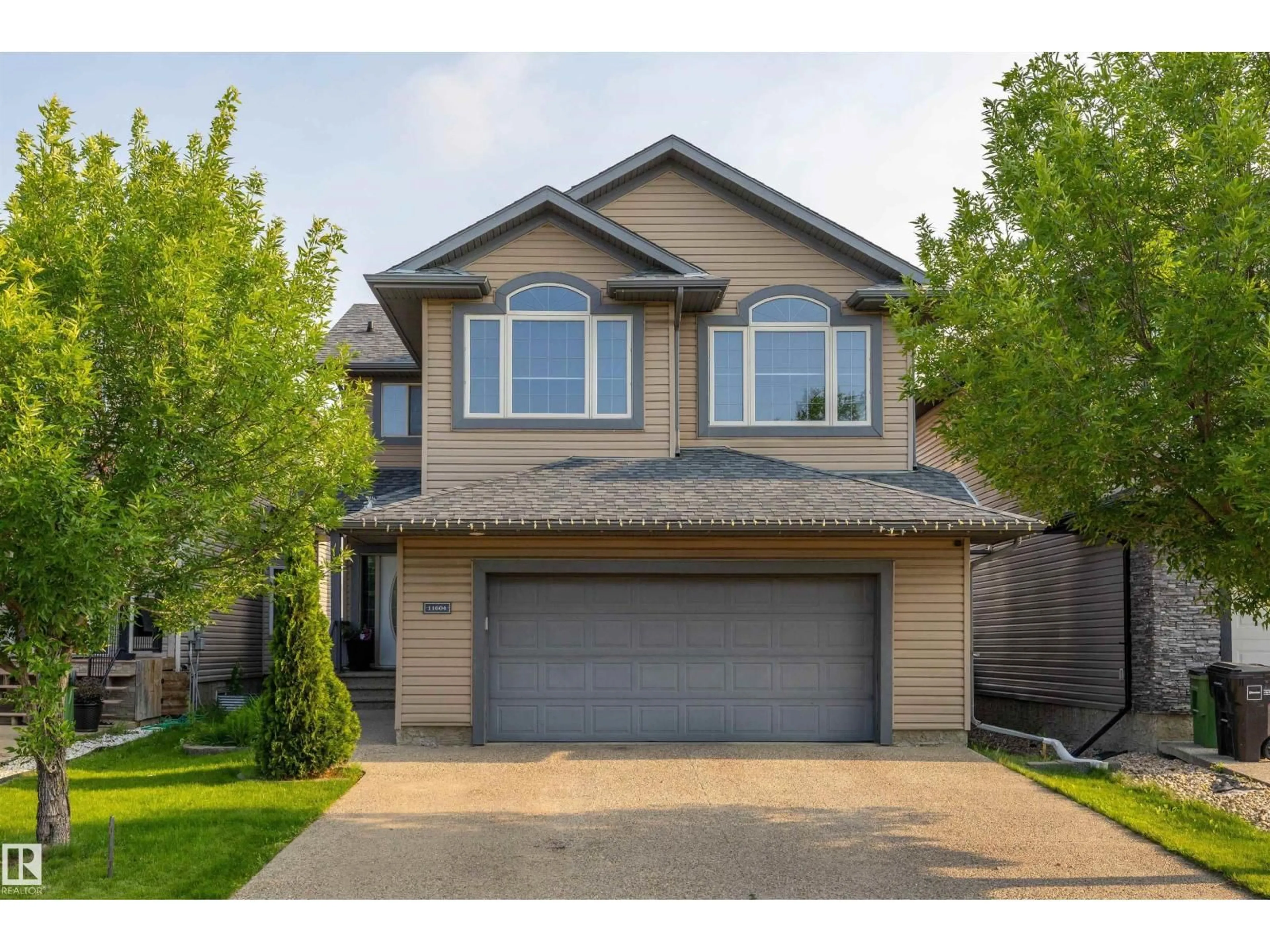 Home with vinyl exterior material, street for 11604 175 AV, Edmonton Alberta T5X0A4