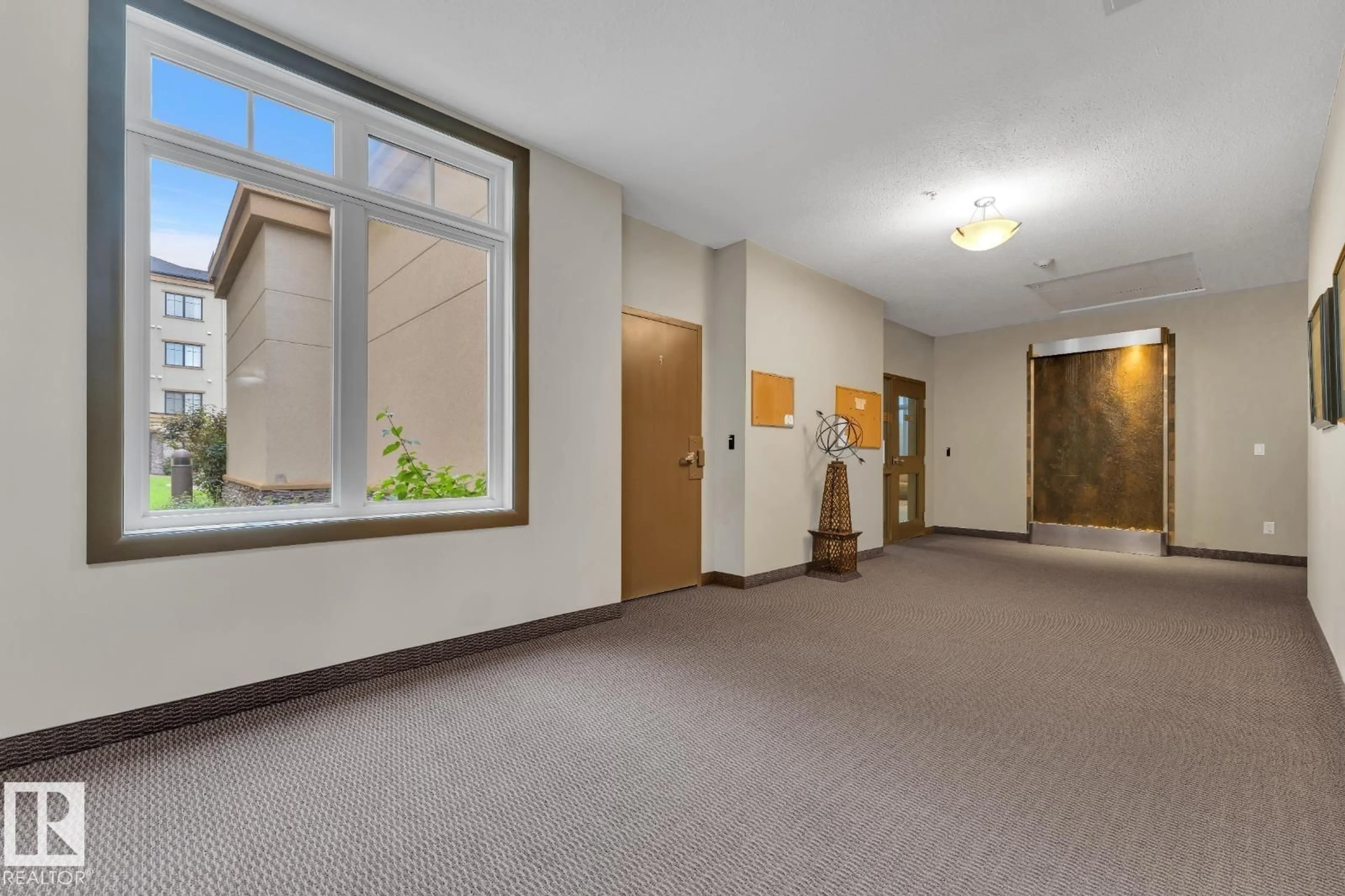 Indoor foyer for #105 - 160 MAGRATH RD, Edmonton Alberta T6E3T7