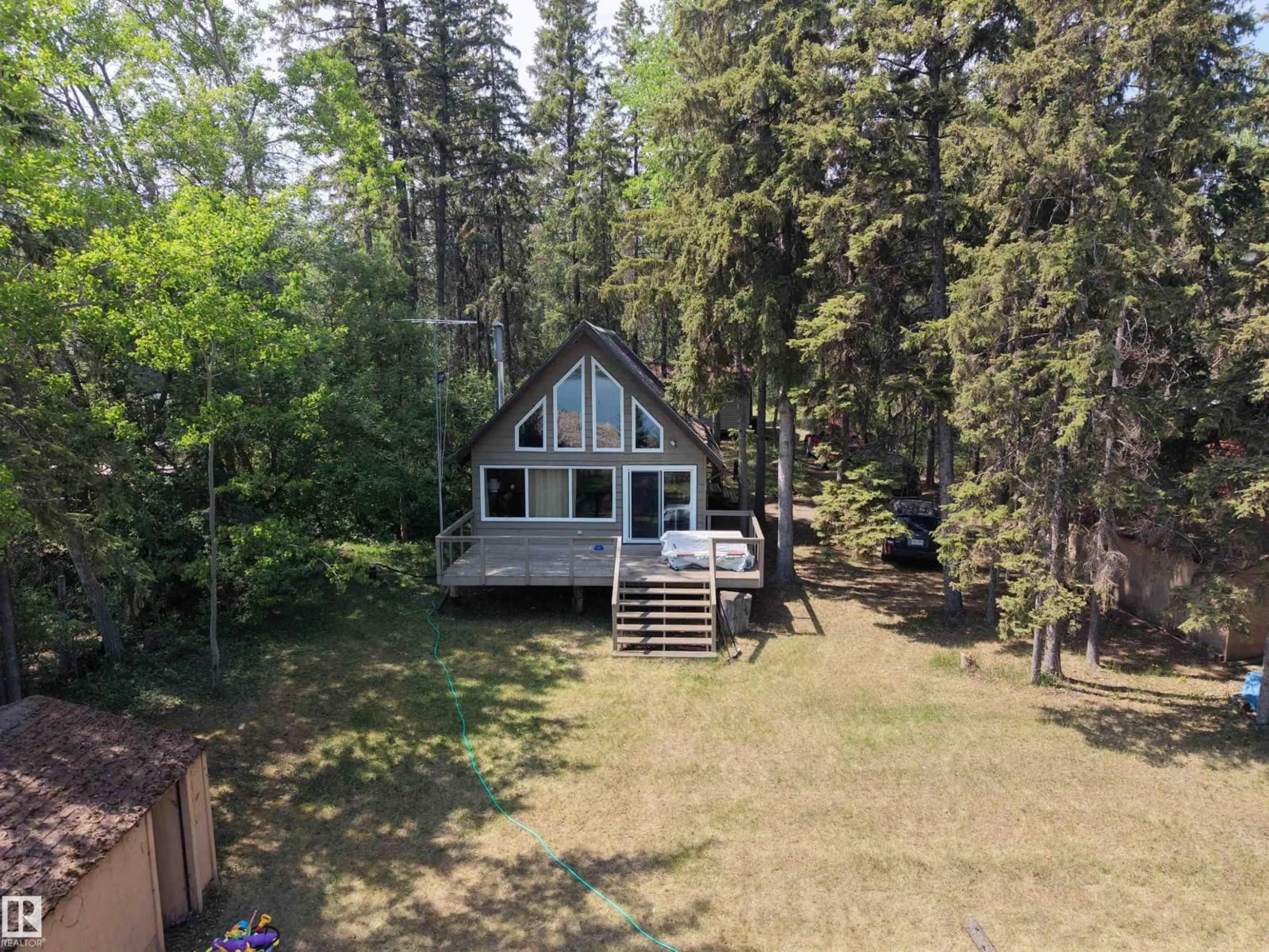 A pic from outside/outdoor area/front of a property/back of a property/a pic from drone, forest/trees view for 4307 SPRUCE PT, Rural Lac Ste. Anne County Alberta T0E1V0