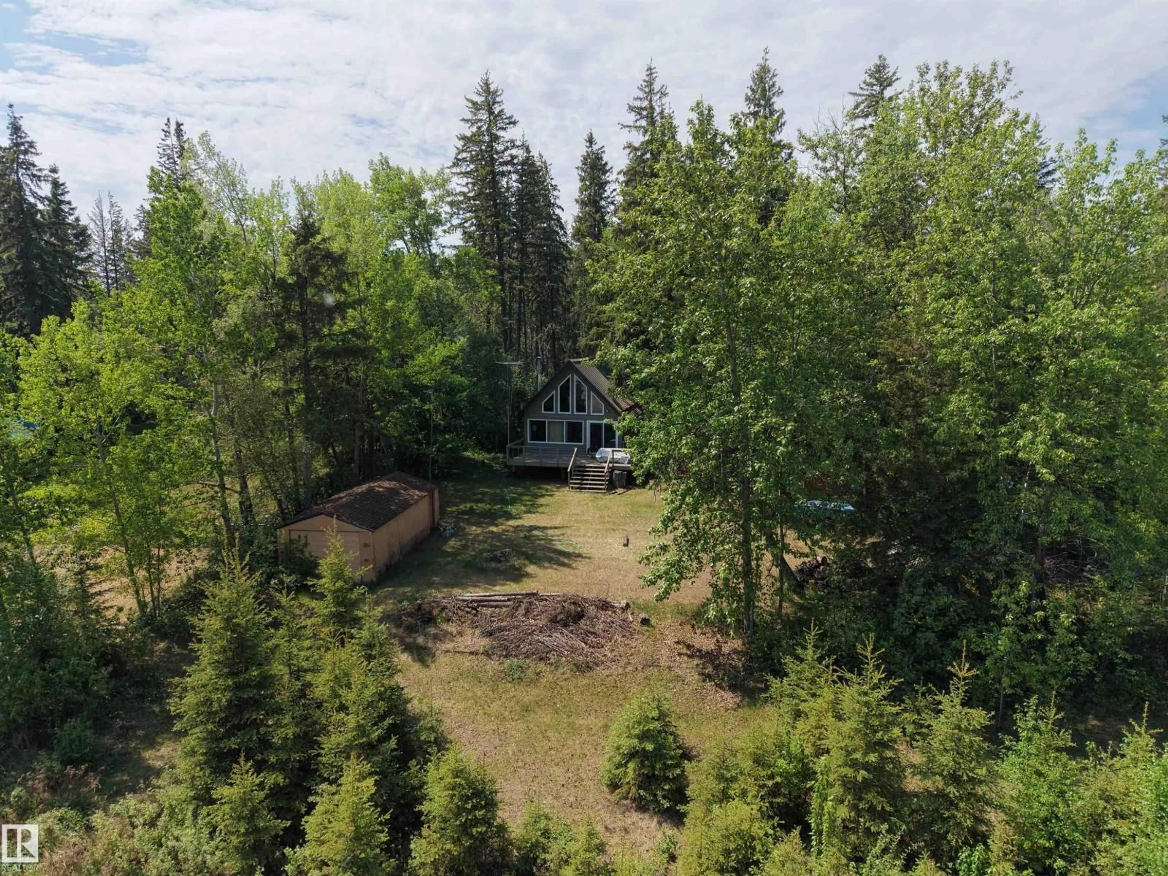 A pic from outside/outdoor area/front of a property/back of a property/a pic from drone, forest/trees view for 4307 SPRUCE PT, Rural Lac Ste. Anne County Alberta T0E1V0