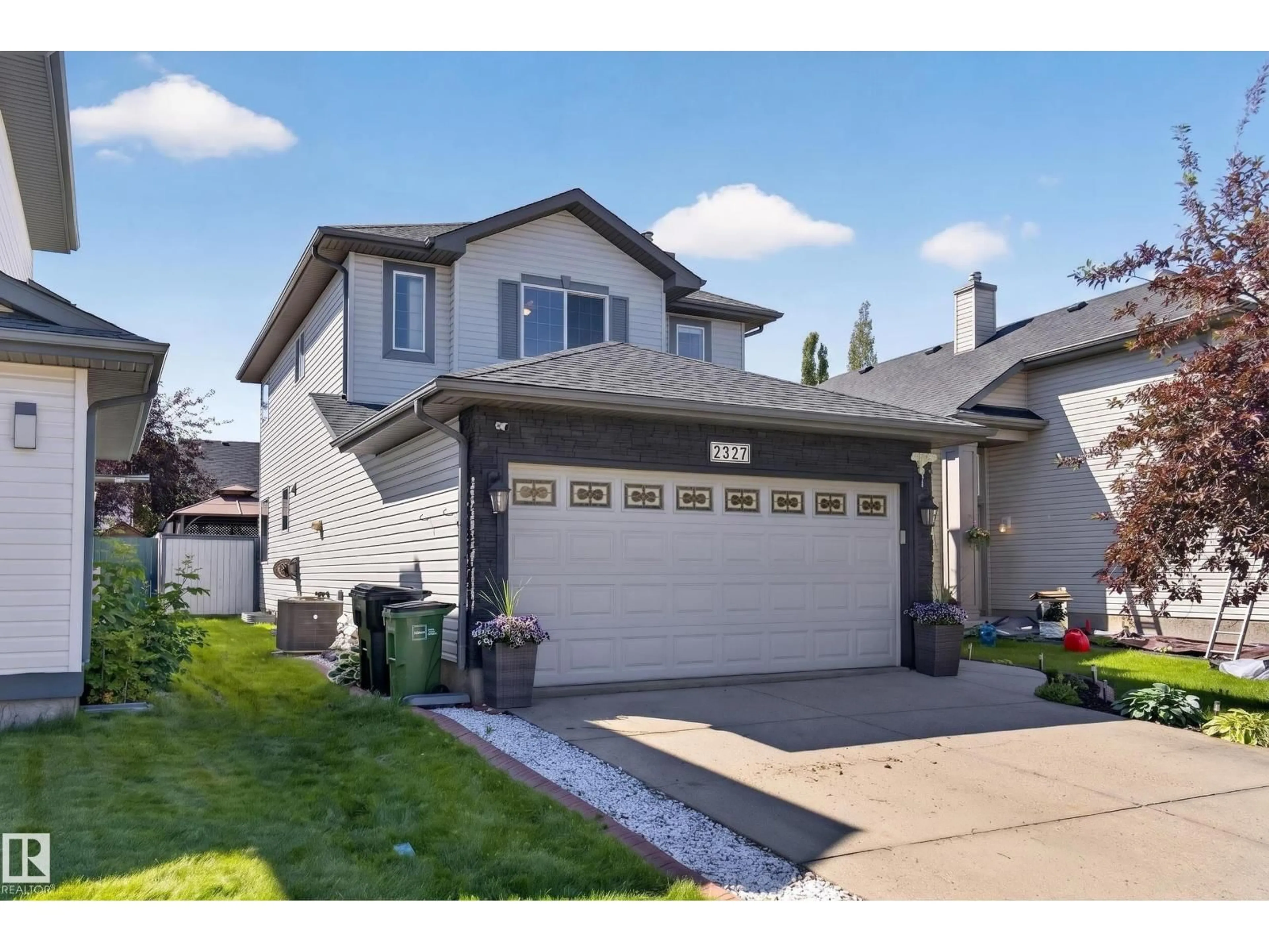 Home with vinyl exterior material, street for 2327 37B AV, Edmonton Alberta T6T1N8