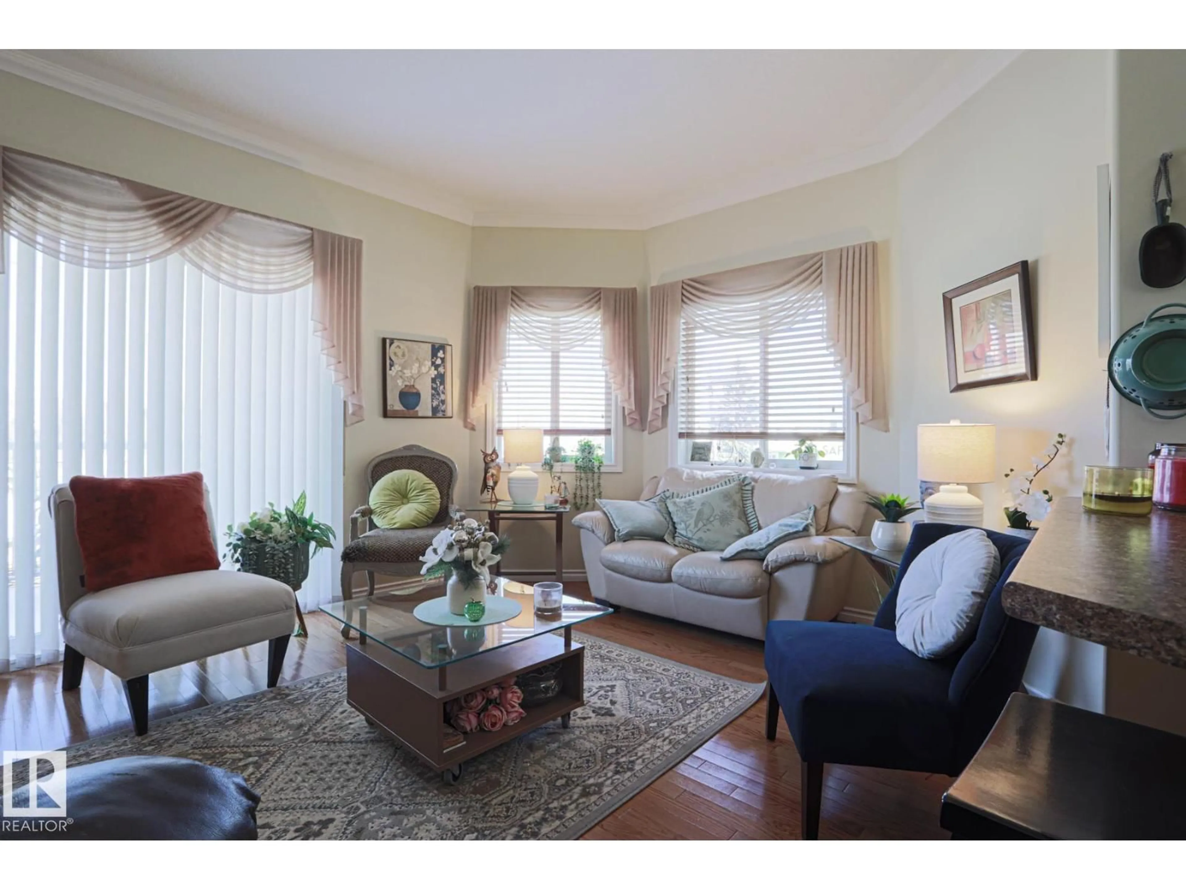 Living room with furniture, wood/laminate floor for 8528 - 314 82 AV NW, Edmonton Alberta T6B0Y8