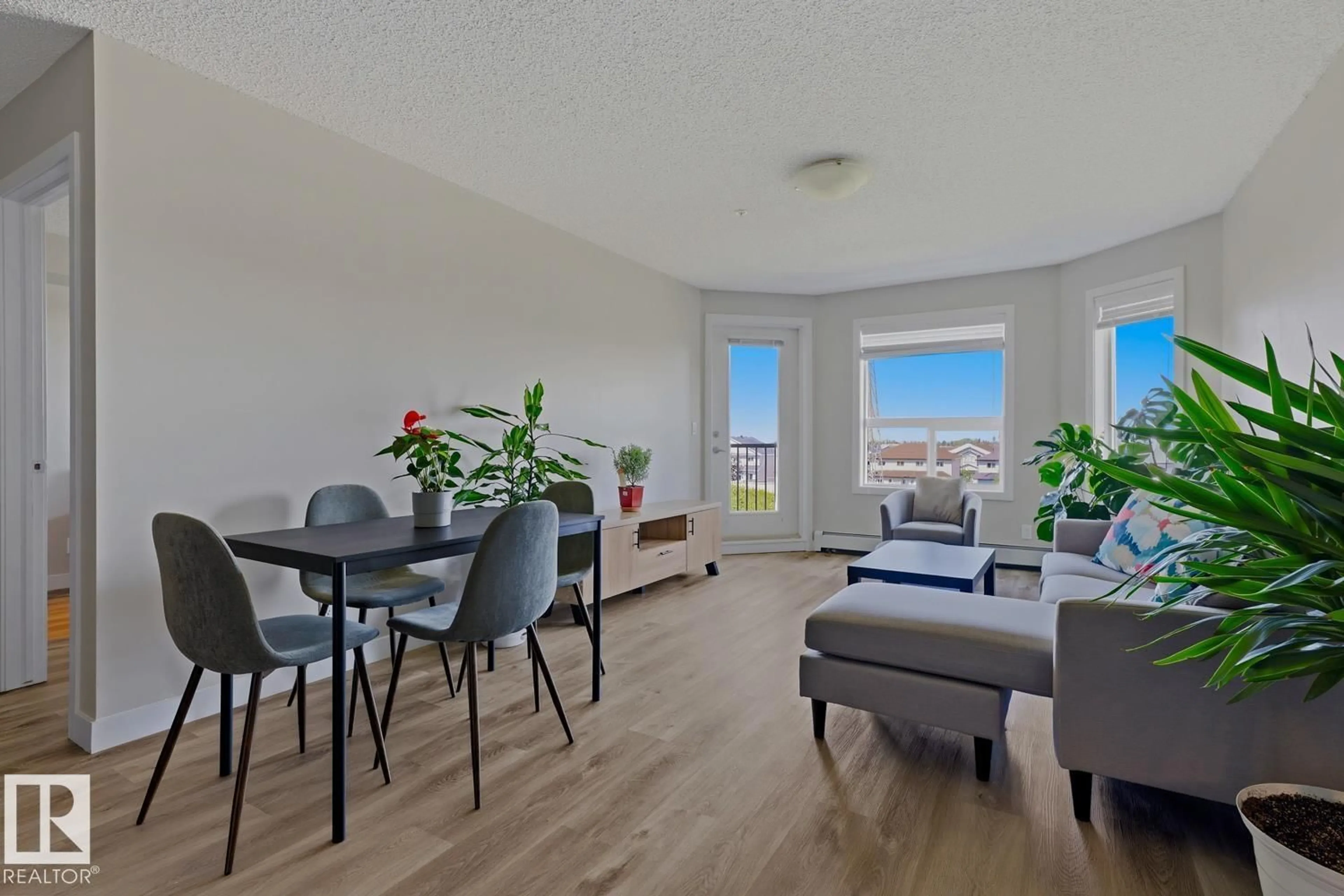 Living room with furniture, wood/laminate floor for 400 - 317 SILVER BERRY RD, Edmonton Alberta T6T0H1