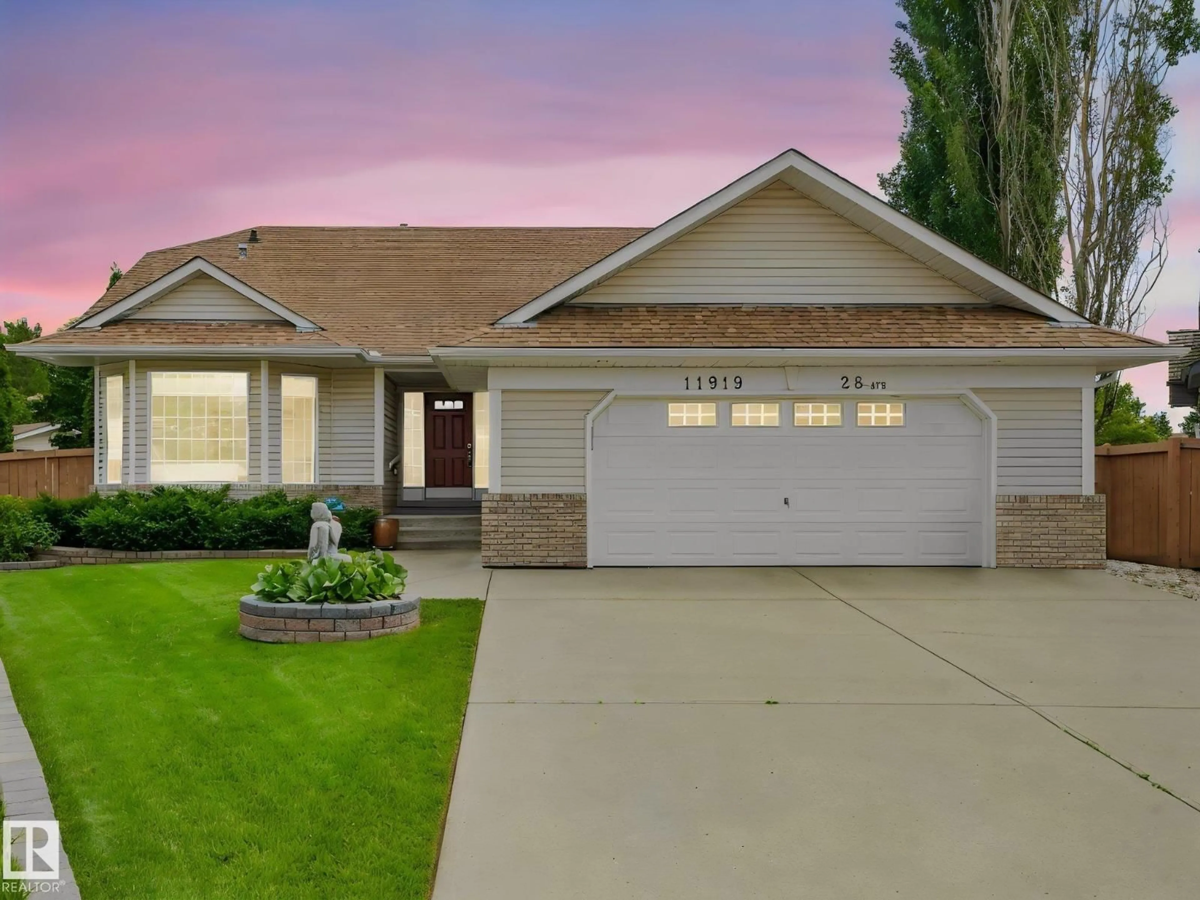 Home with vinyl exterior material, street for 11919 28 AV, Edmonton Alberta T6J6C1