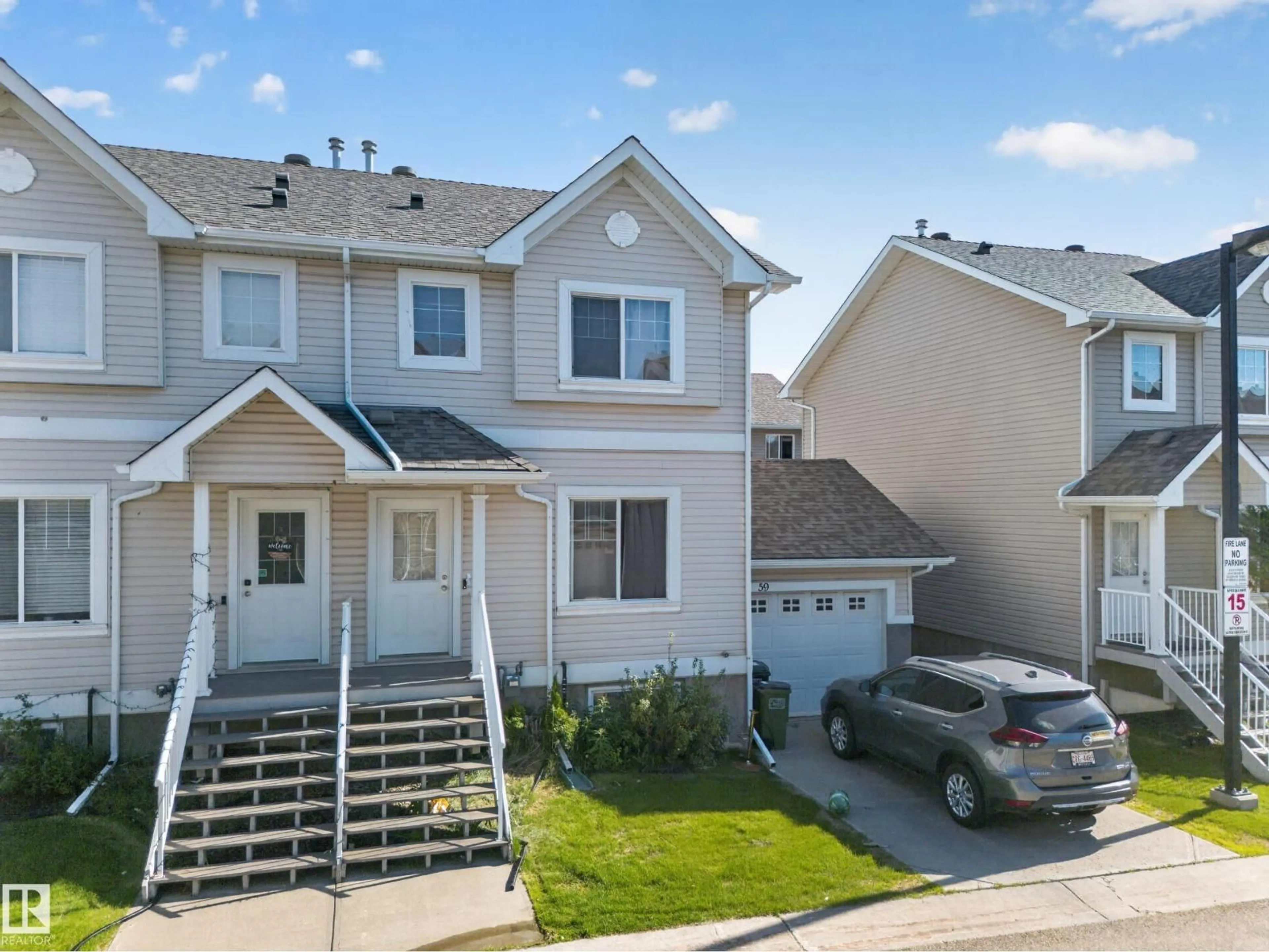 Home with vinyl exterior material, street for 59 - 2503 24 ST NW, Edmonton Alberta T6T0B5