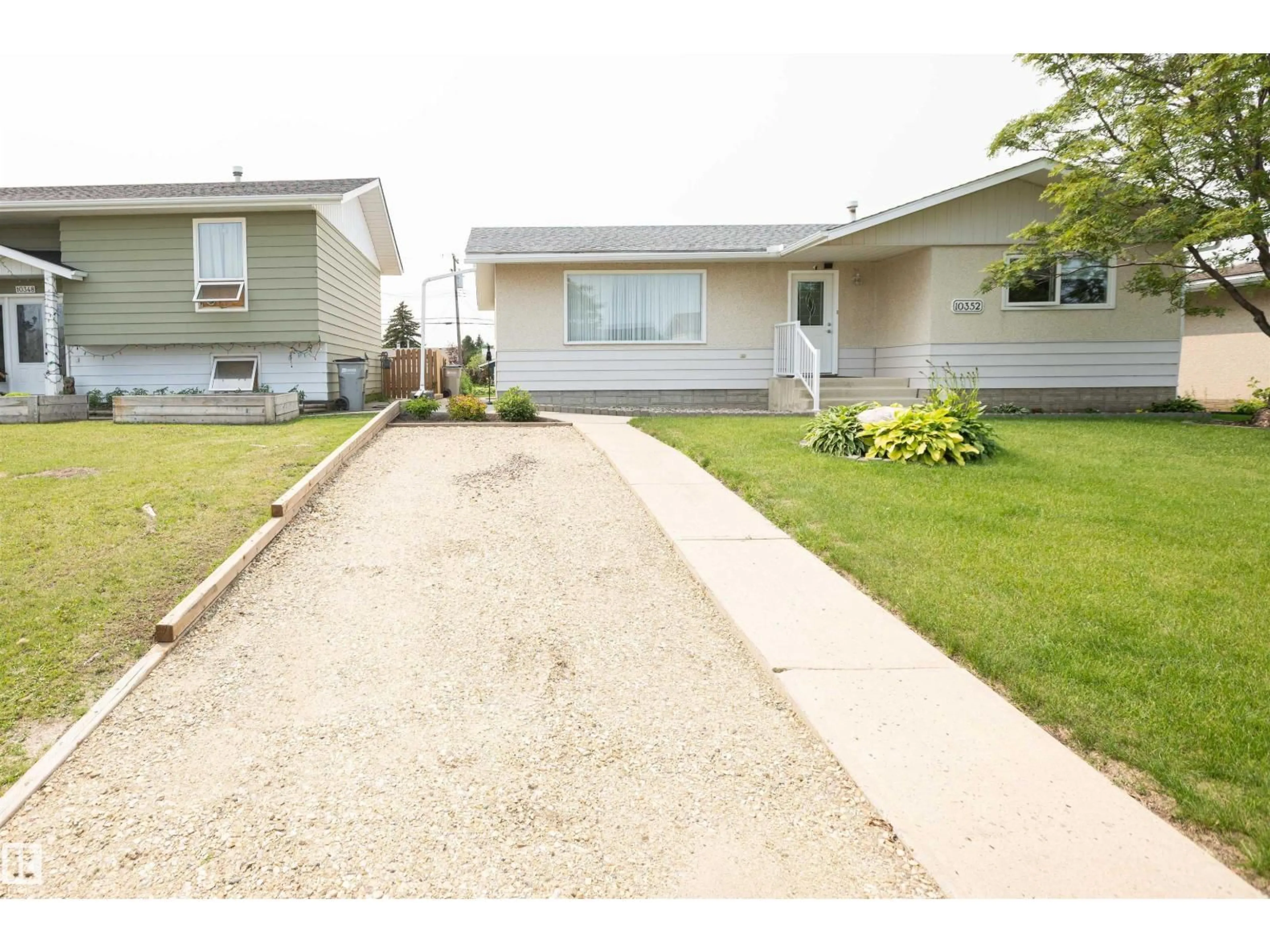 Home with vinyl exterior material, street for 10352 109 AVE, Westlock Alberta T7P1G9
