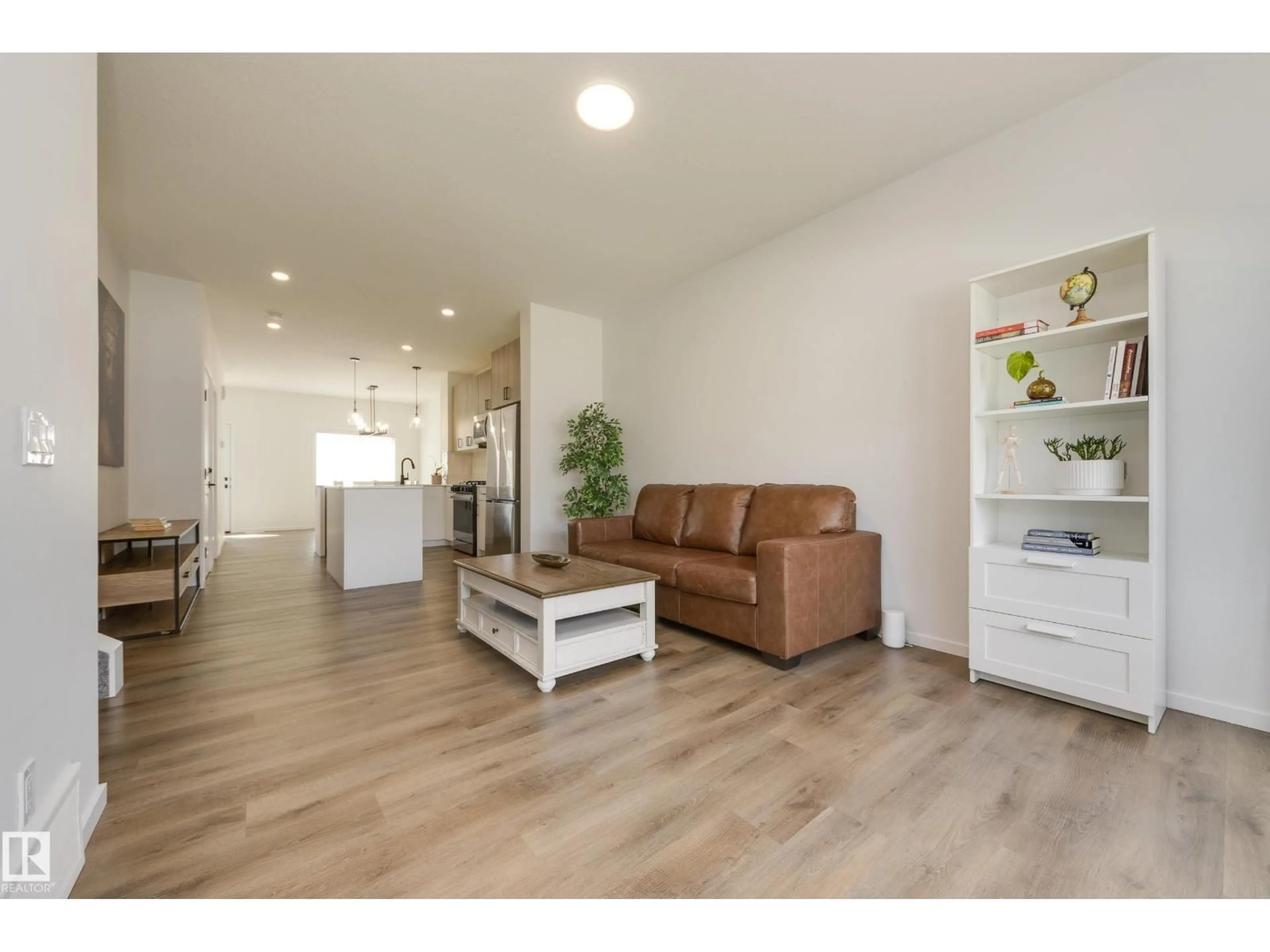 Living room with furniture, wood/laminate floor for 2804 193 ST, Edmonton Alberta T6M3B2