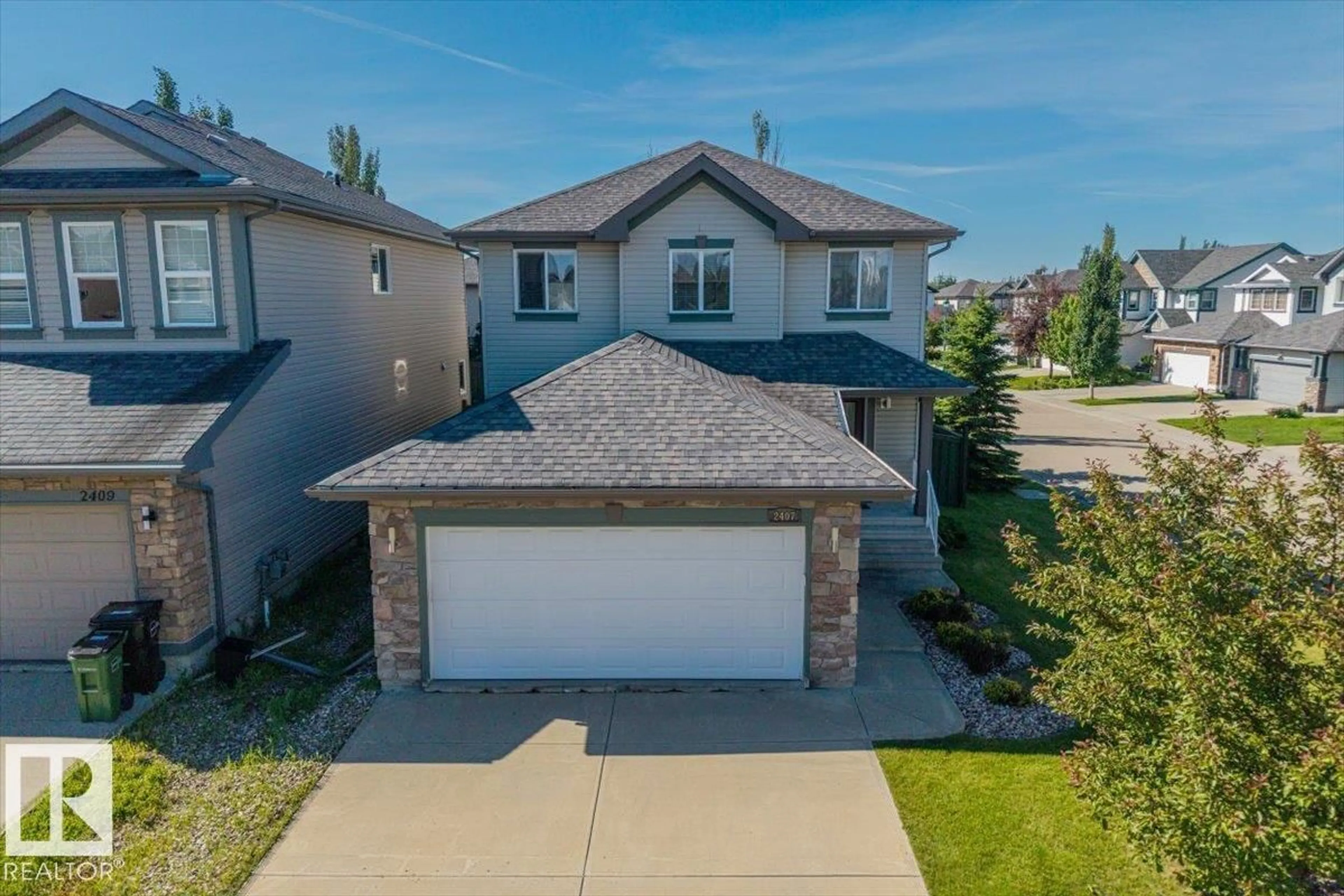 A pic from outside/outdoor area/front of a property/back of a property/a pic from drone, street for 2407 HAGEN WY, Edmonton Alberta T6R3M6