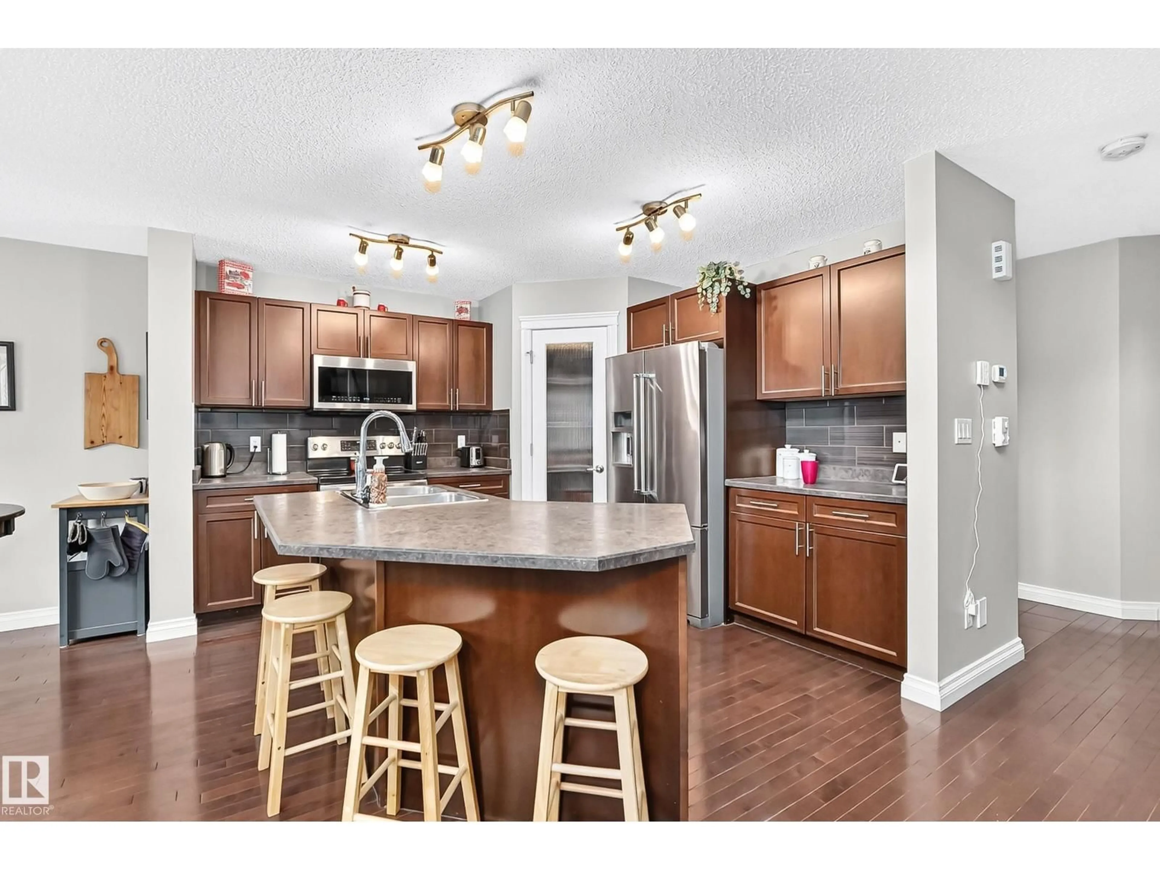 Open concept kitchen, wood/laminate floor for 26 HAMILTON, Spruce Grove Alberta T7X0K4