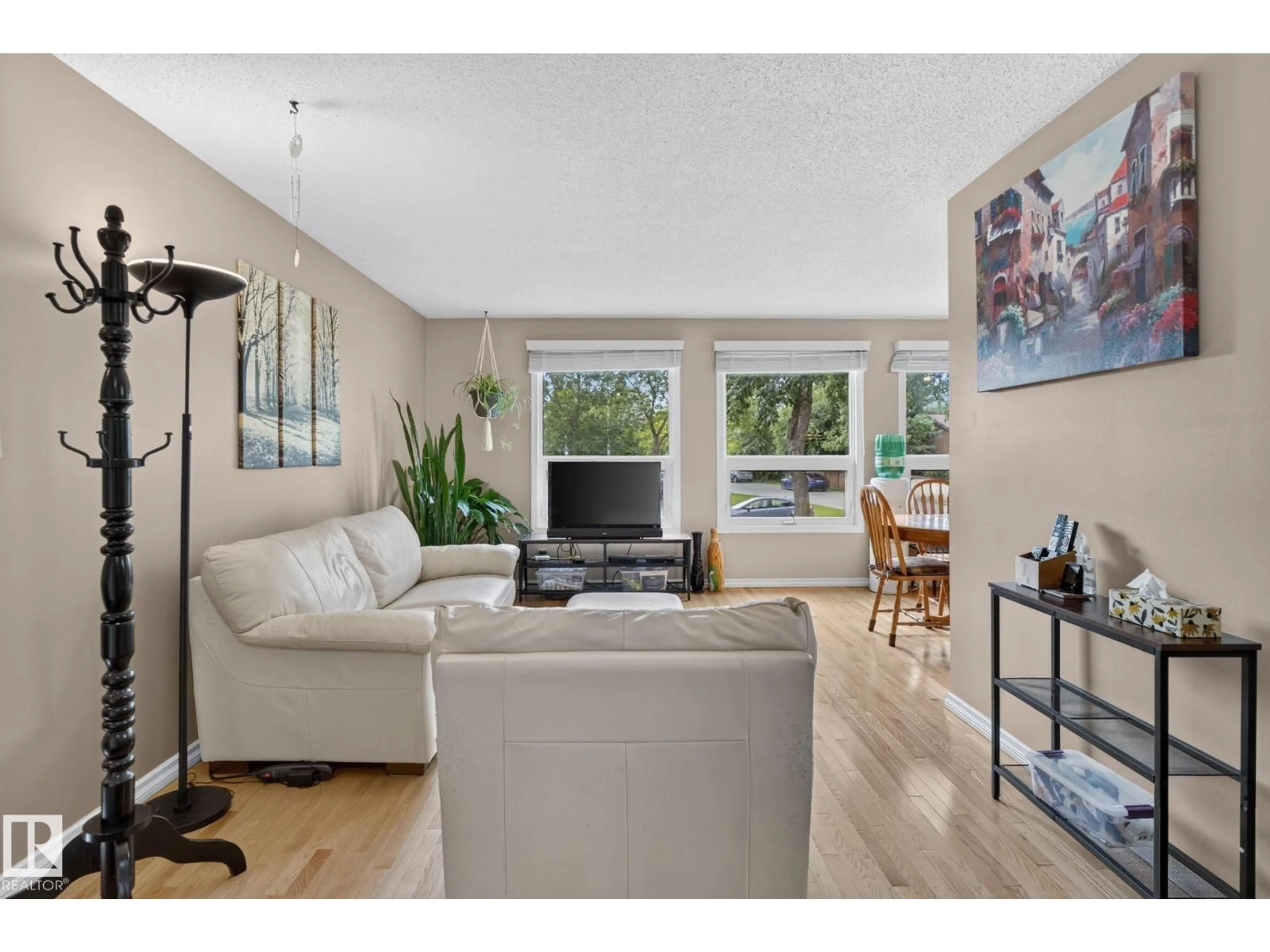 Living room with furniture, wood/laminate floor for 31 ALPINE BV, St. Albert Alberta T8N2L9