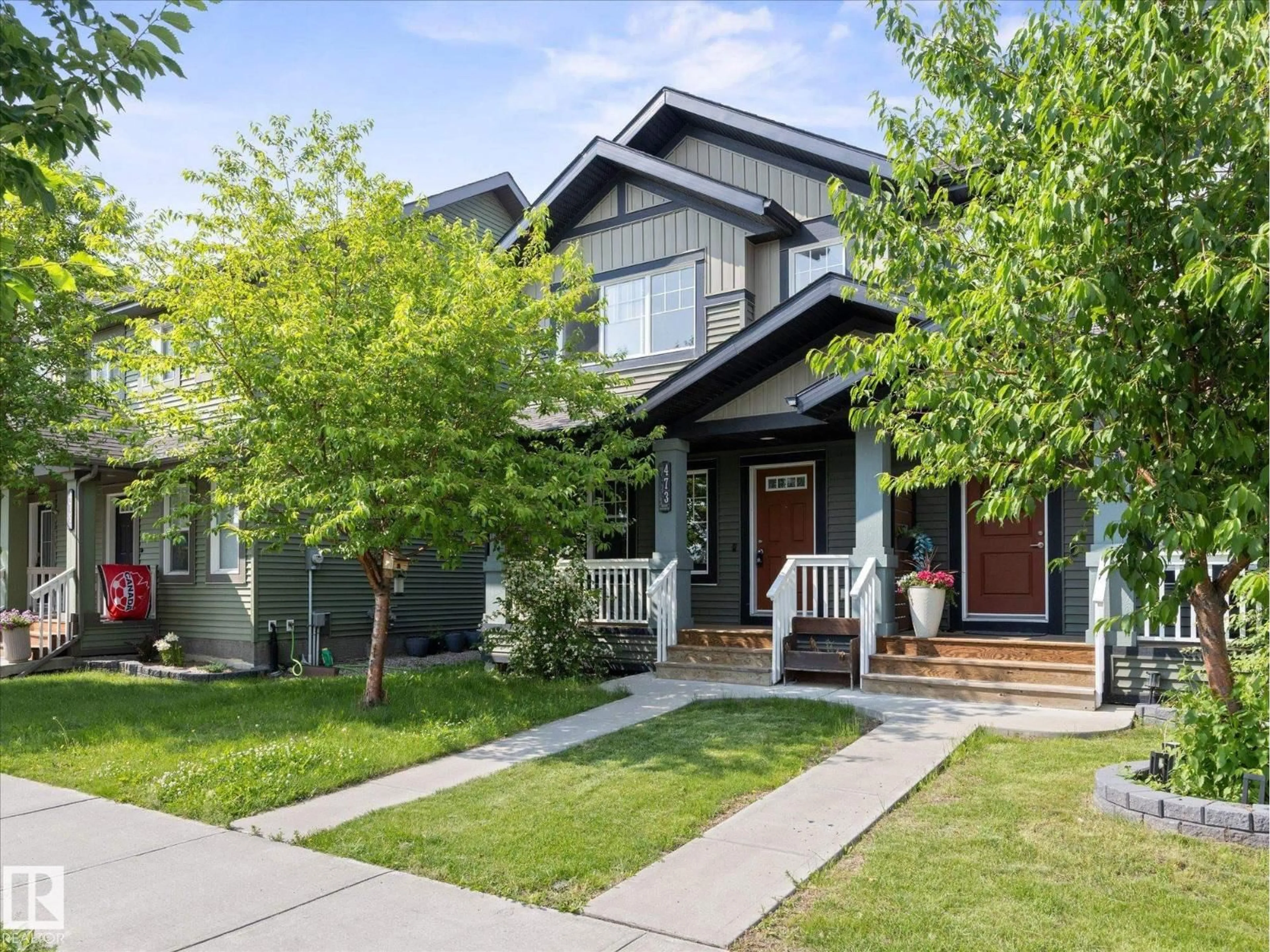 Home with vinyl exterior material, street for 473 ORCHARDS BV, Edmonton Alberta T6X2B7