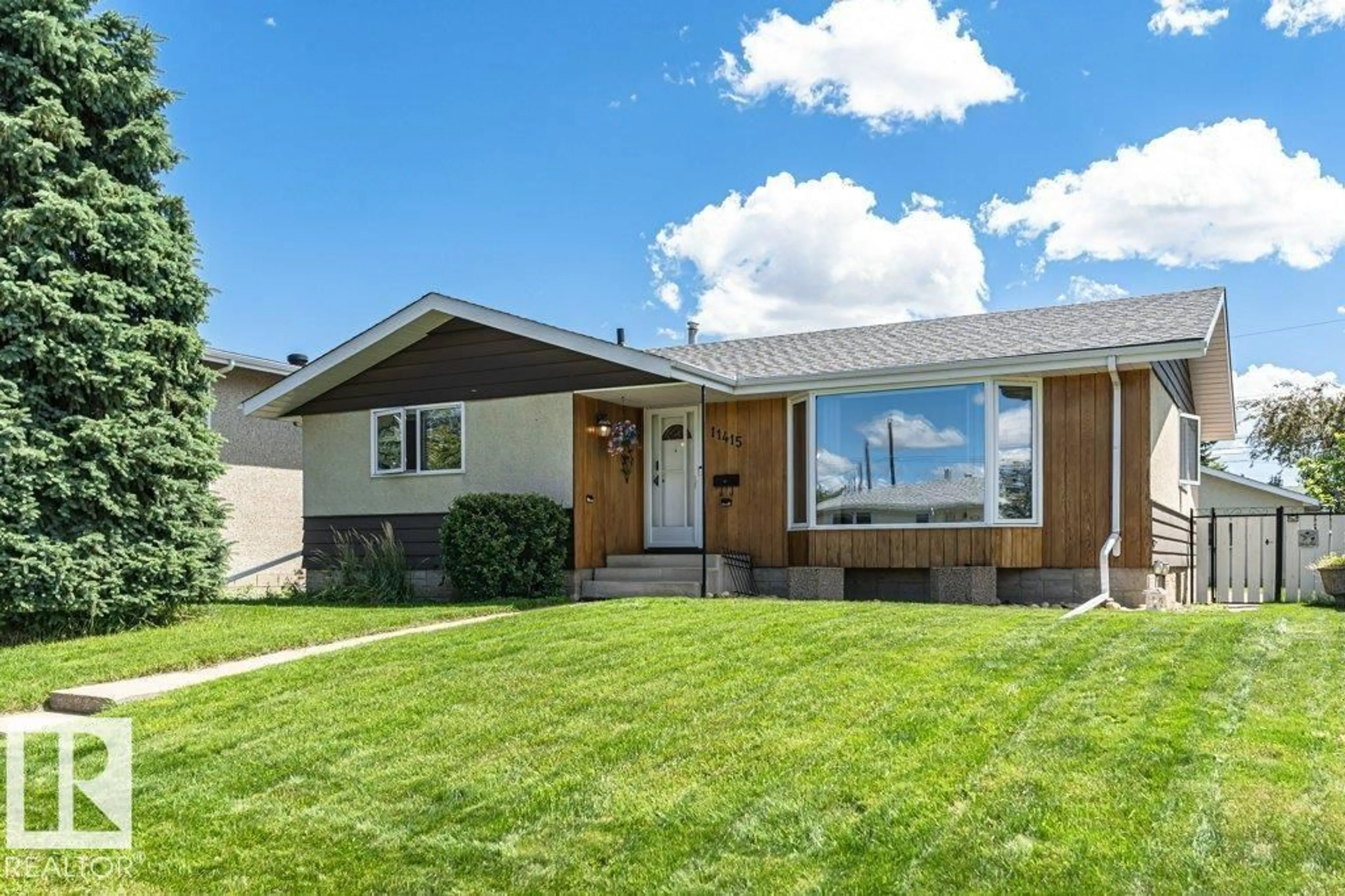 Home with vinyl exterior material, street for NW - 11415 56 AV, Edmonton Alberta T6H0Y1