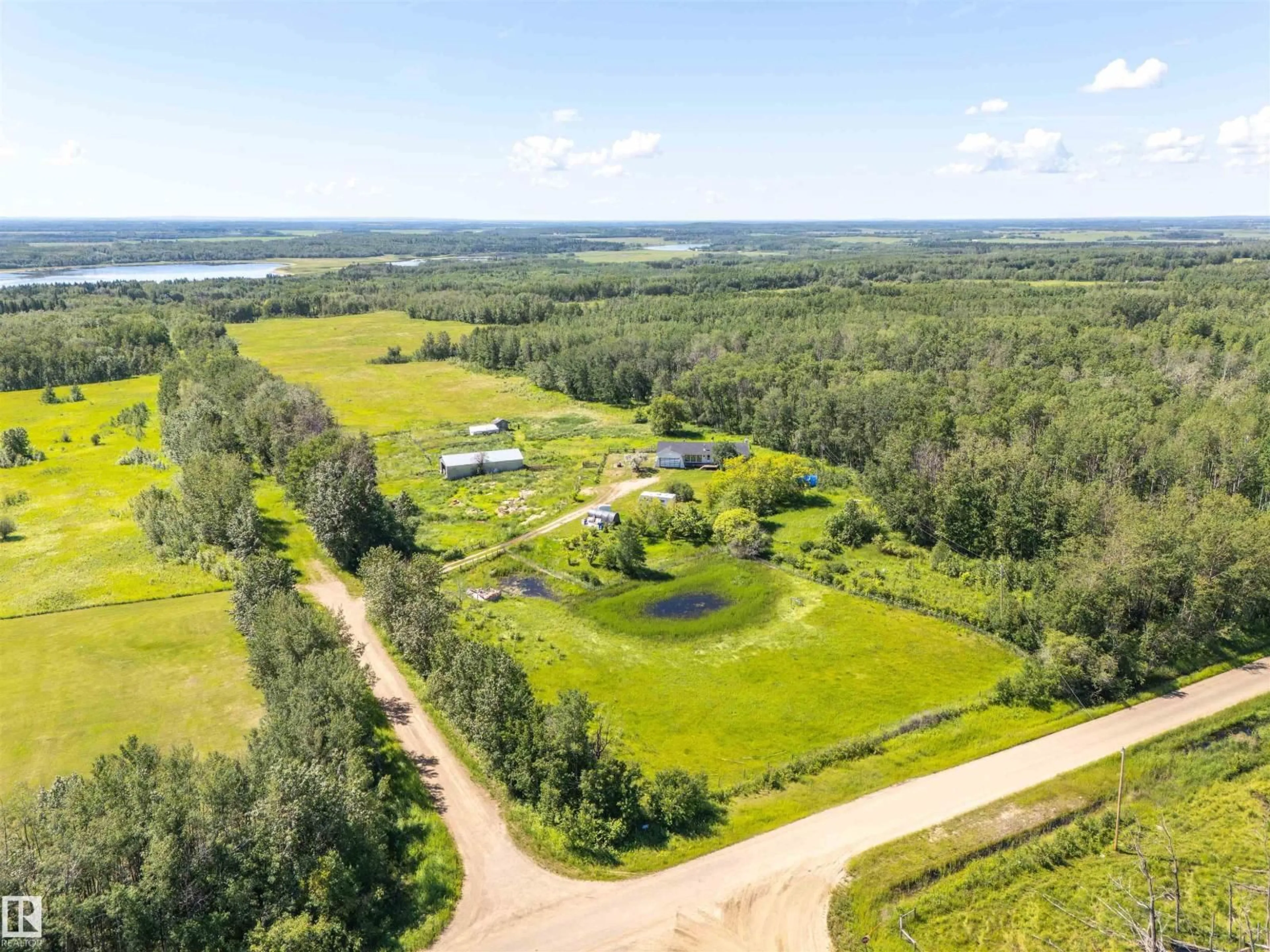 A pic from outside/outdoor area/front of a property/back of a property/a pic from drone, water/lake/river/ocean view for 63432 RGE RD 445A, Rural Bonnyville M.D. Alberta T9M1P1