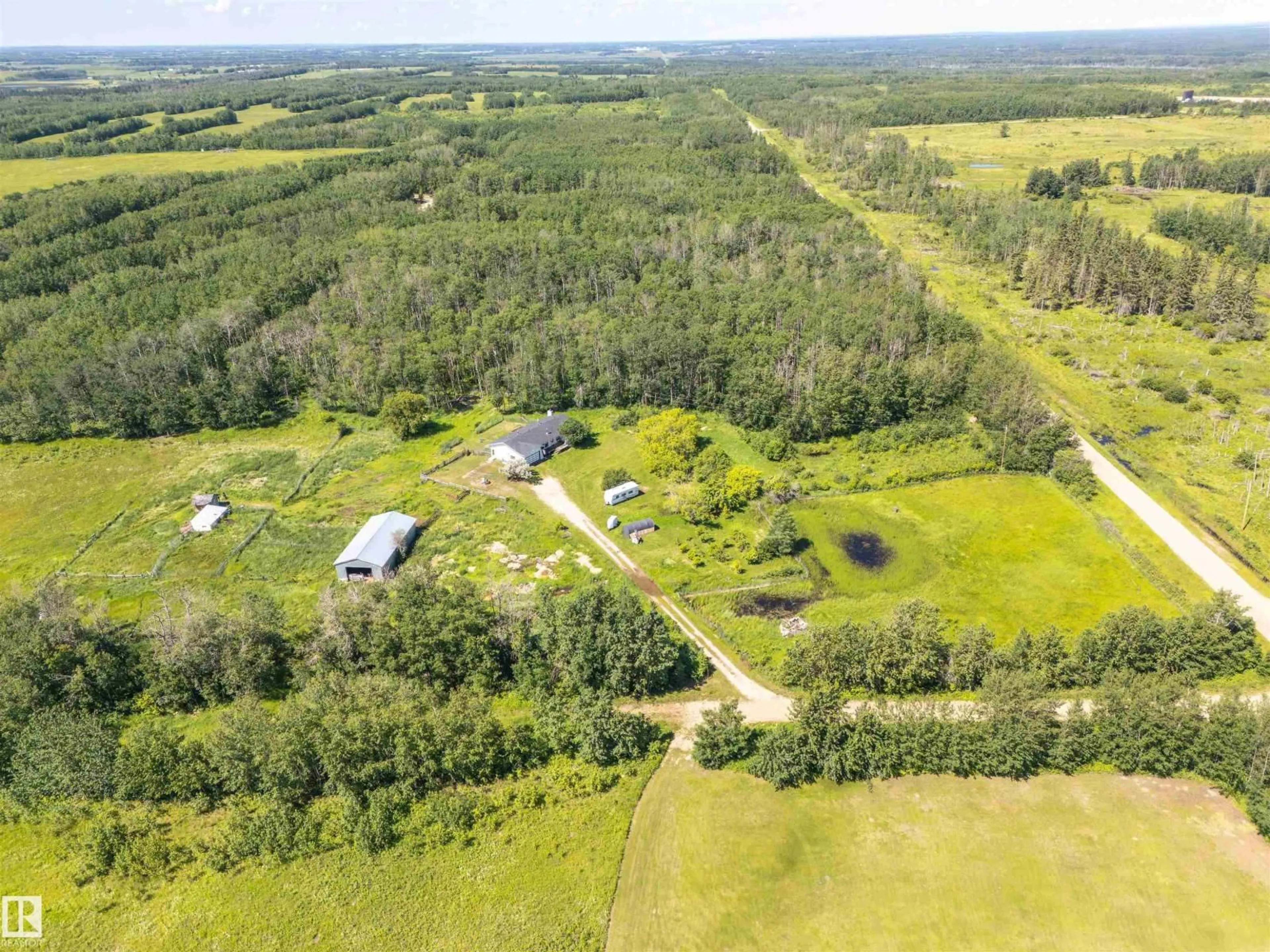 A pic from outside/outdoor area/front of a property/back of a property/a pic from drone, forest/trees view for 63432 RGE RD 445A, Rural Bonnyville M.D. Alberta T9M1P1