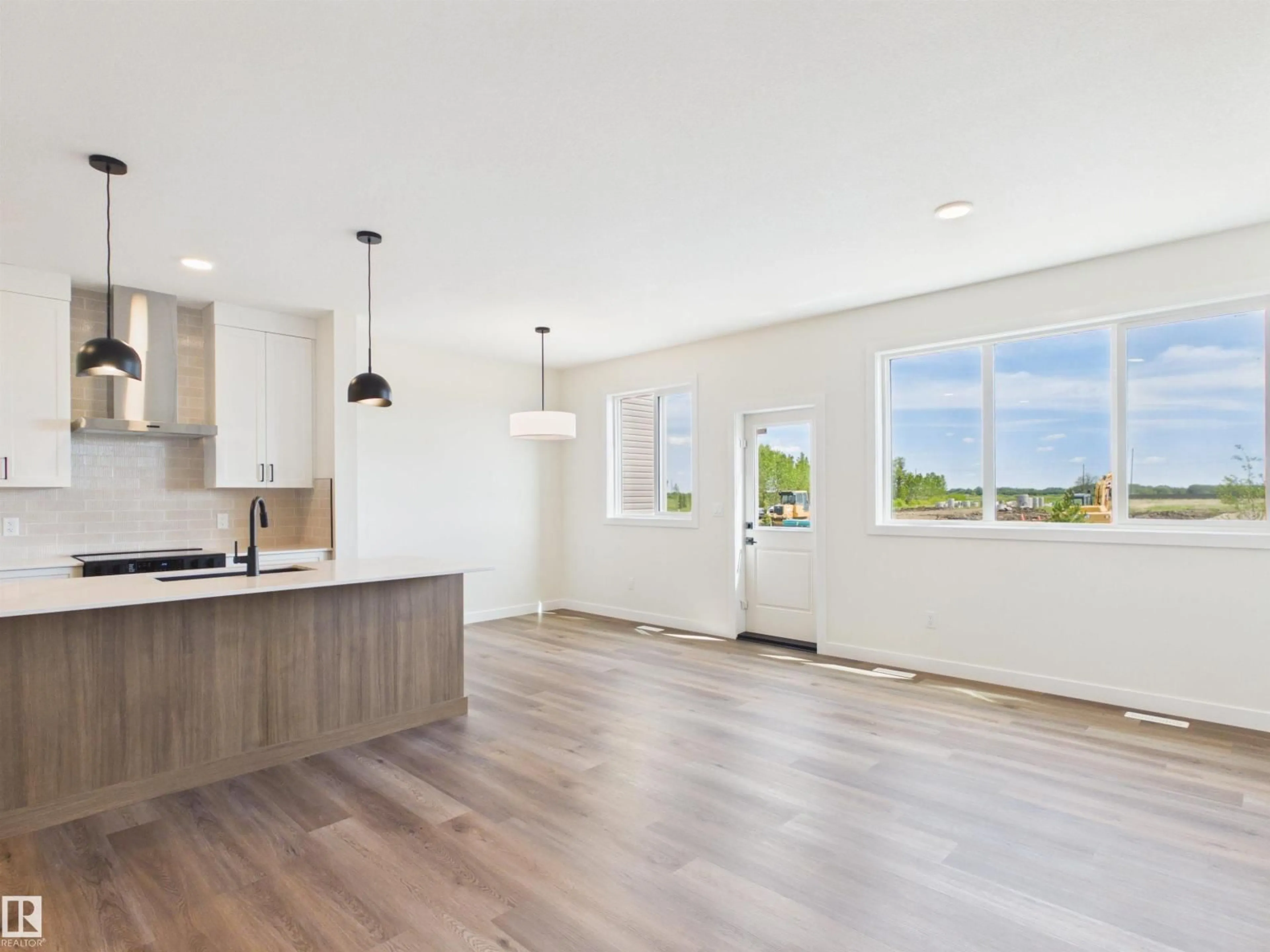 Open concept kitchen, wood/laminate floor for 117 HILTON CV, Spruce Grove Alberta T7X1Y4