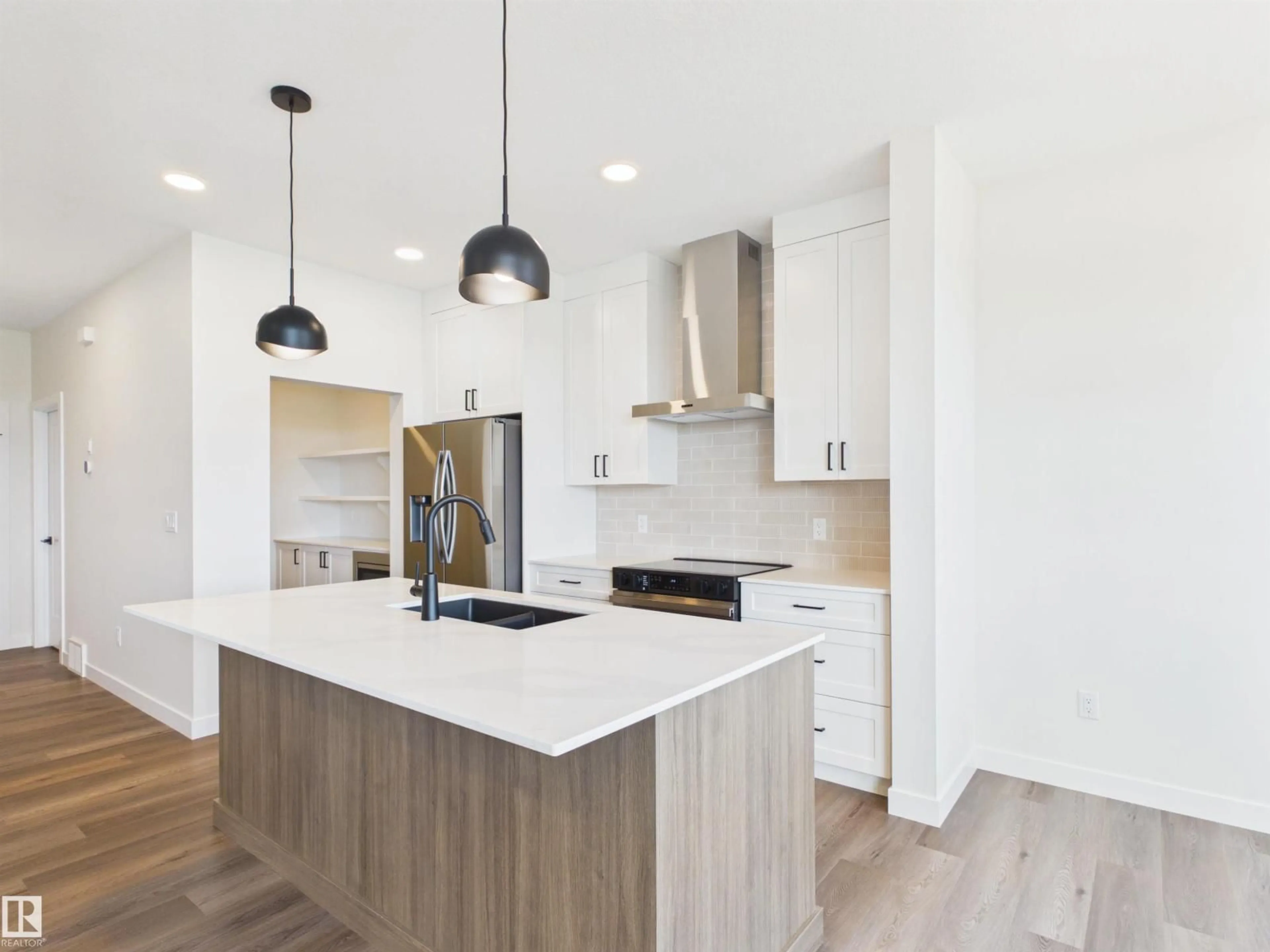 Open concept kitchen, wood/laminate floor for 117 HILTON CV, Spruce Grove Alberta T7X1Y4