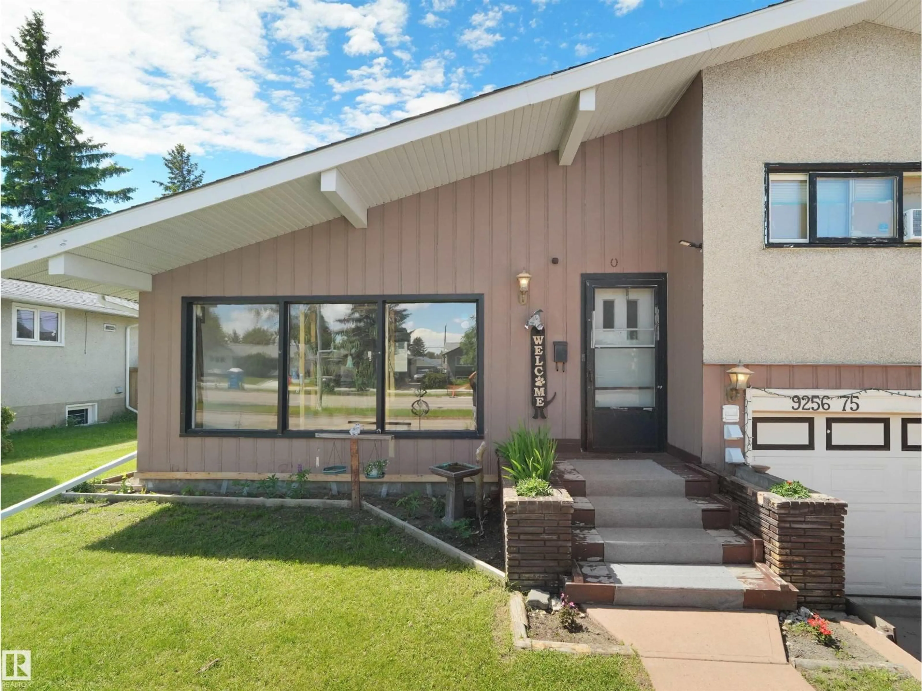 Home with vinyl exterior material, street for NW - 9256 75 ST, Edmonton Alberta T6C2H4