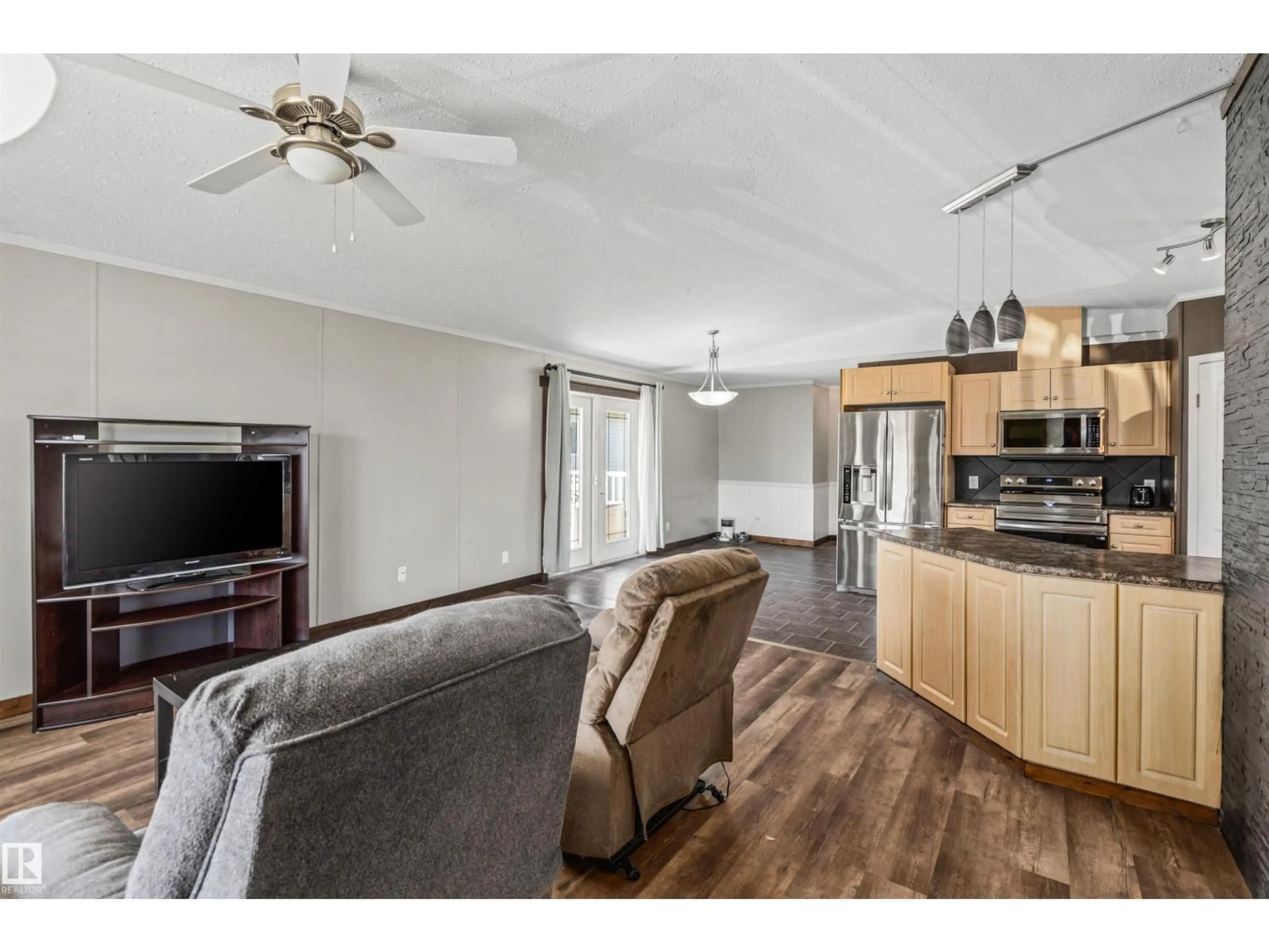 Living room with furniture, wood/laminate floor for 1172 ASPEN DR, Leduc Alberta T9E8R2