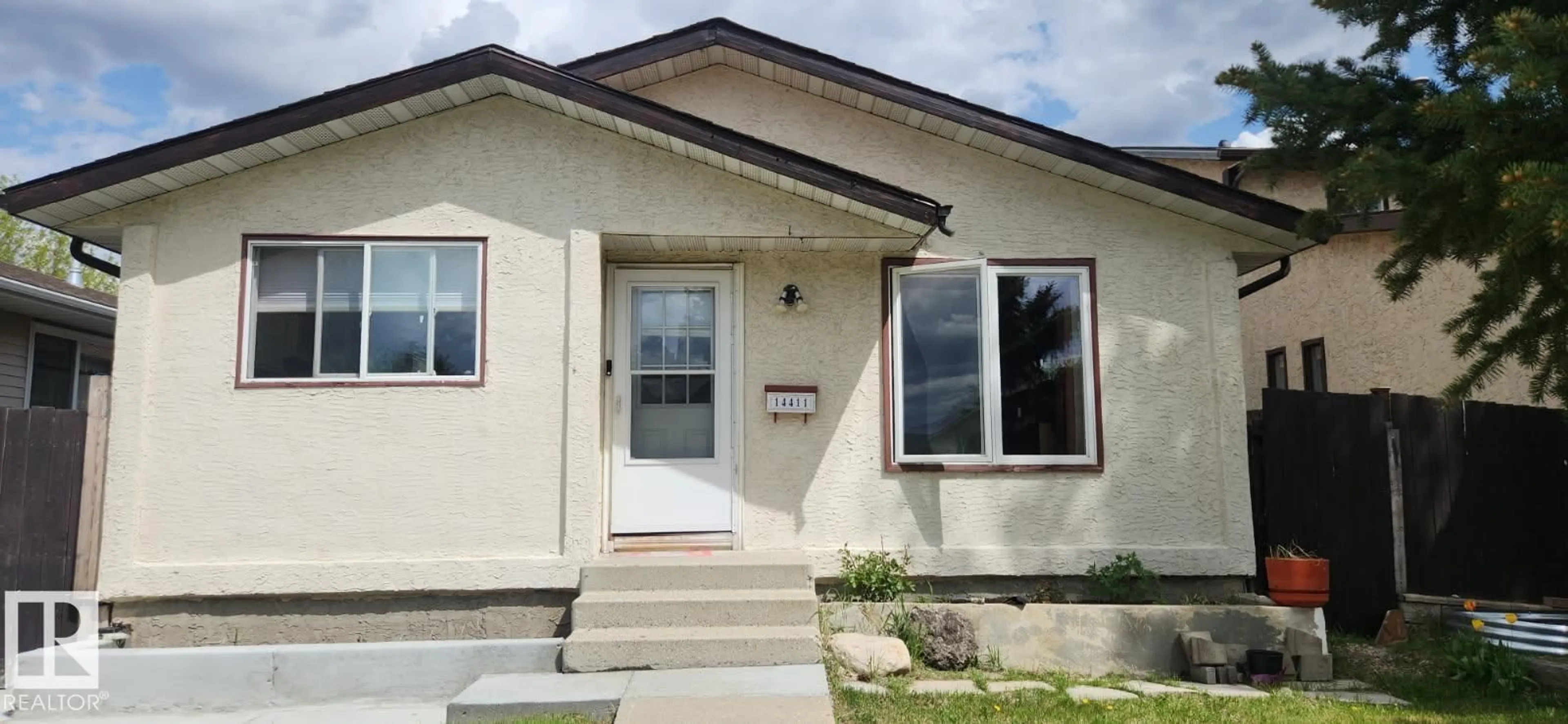 Home with vinyl exterior material, street for 14411 31 ST, Edmonton Alberta T5Y1Z1