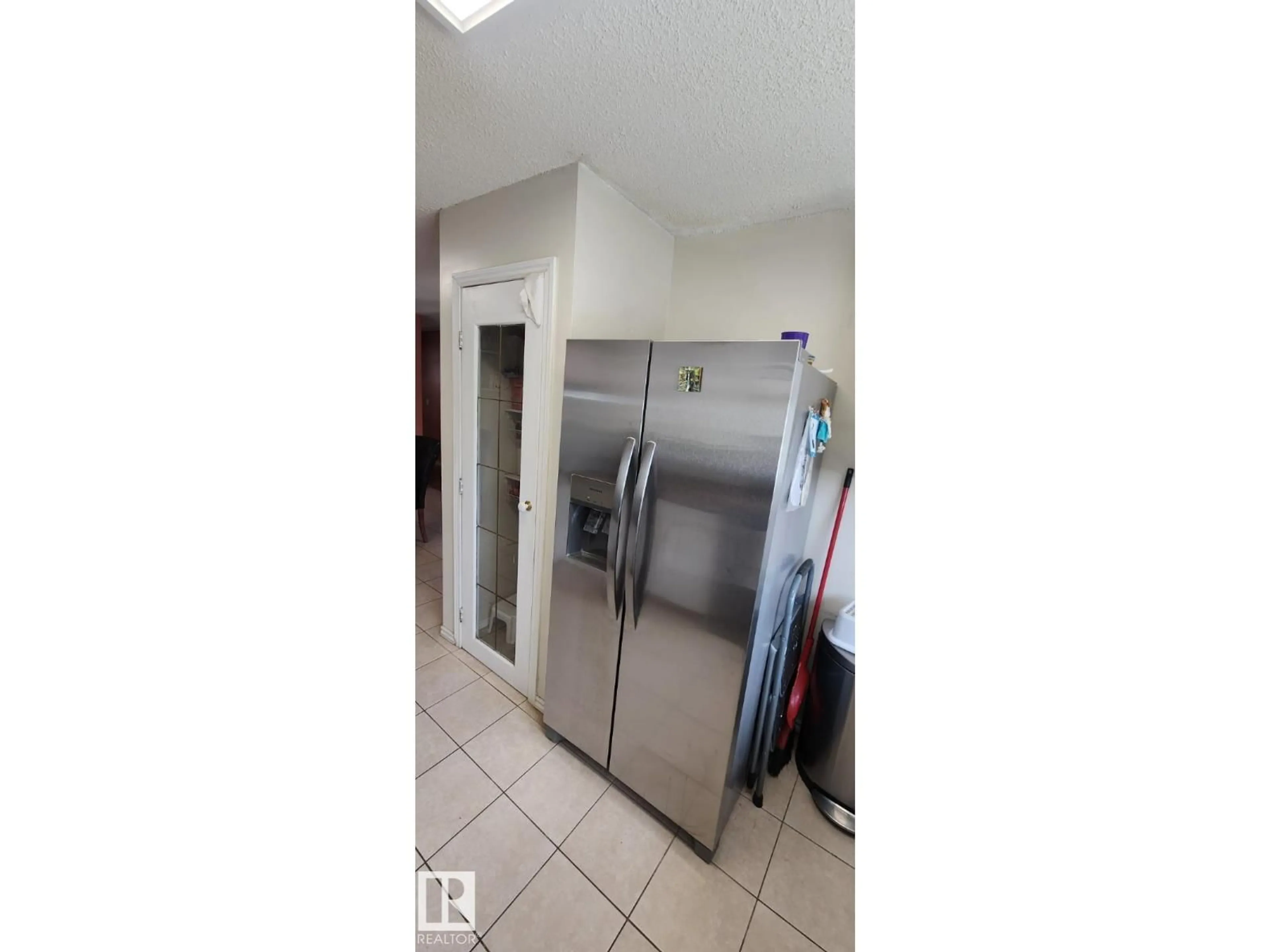 Kitchen with laundary machines, unknown for 14411 31 ST, Edmonton Alberta T5Y1Z1