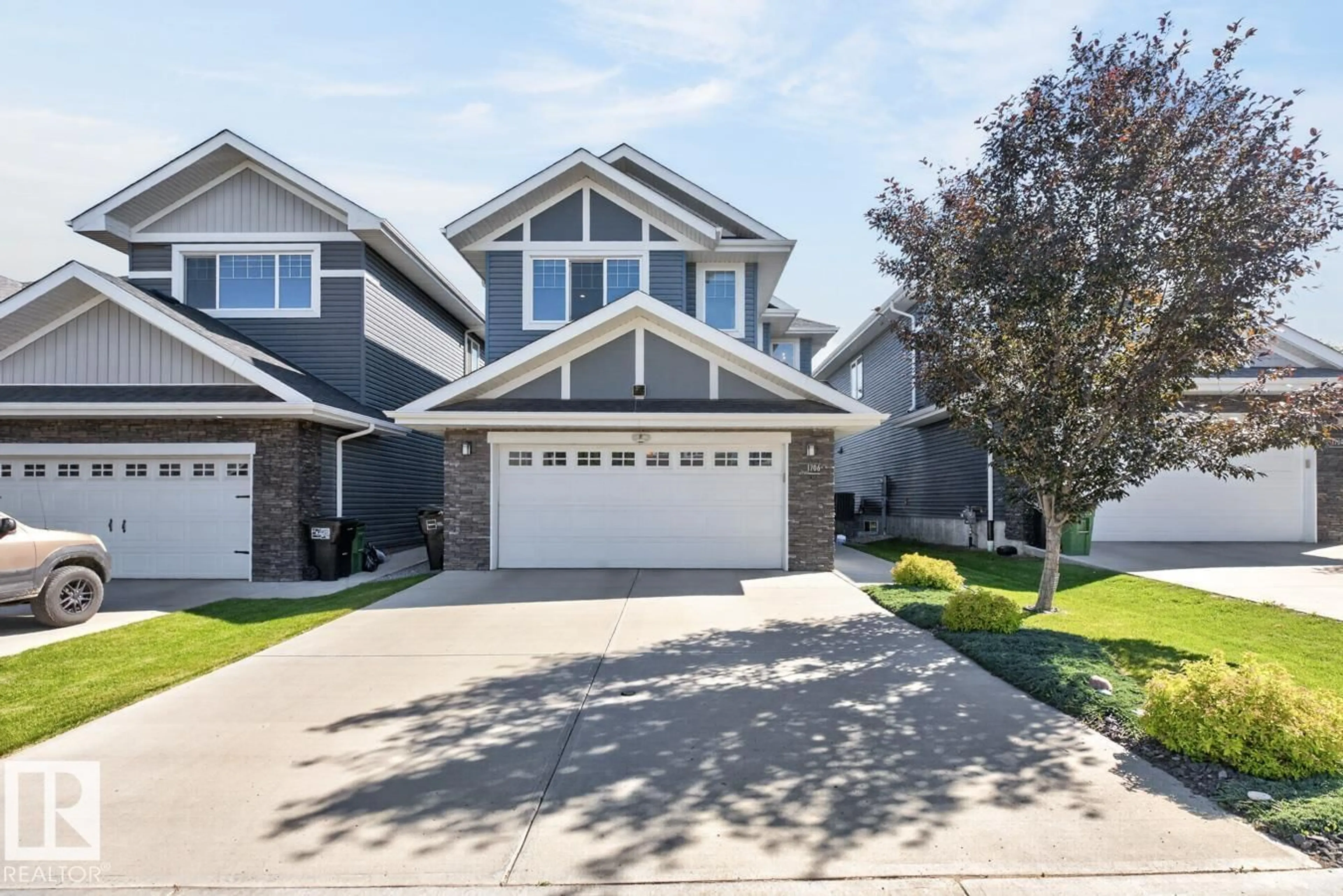 Home with vinyl exterior material, street for 1706 TANAGER CL, Edmonton Alberta T5S0M5